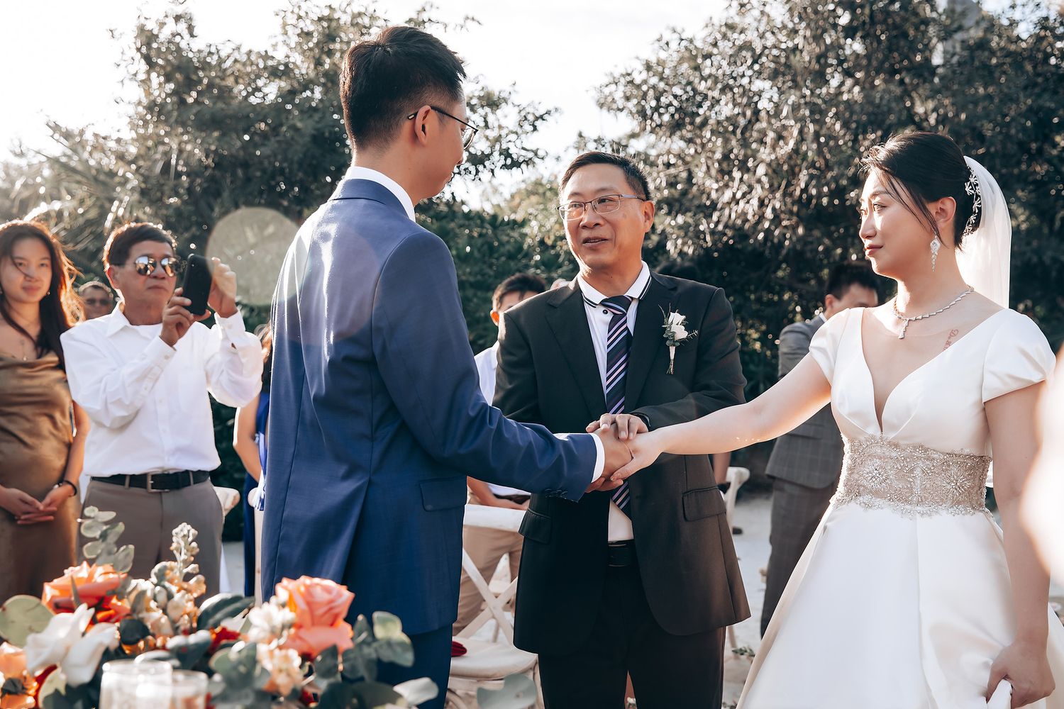 Wedding celebration with guests enjoying outdoor festivities.