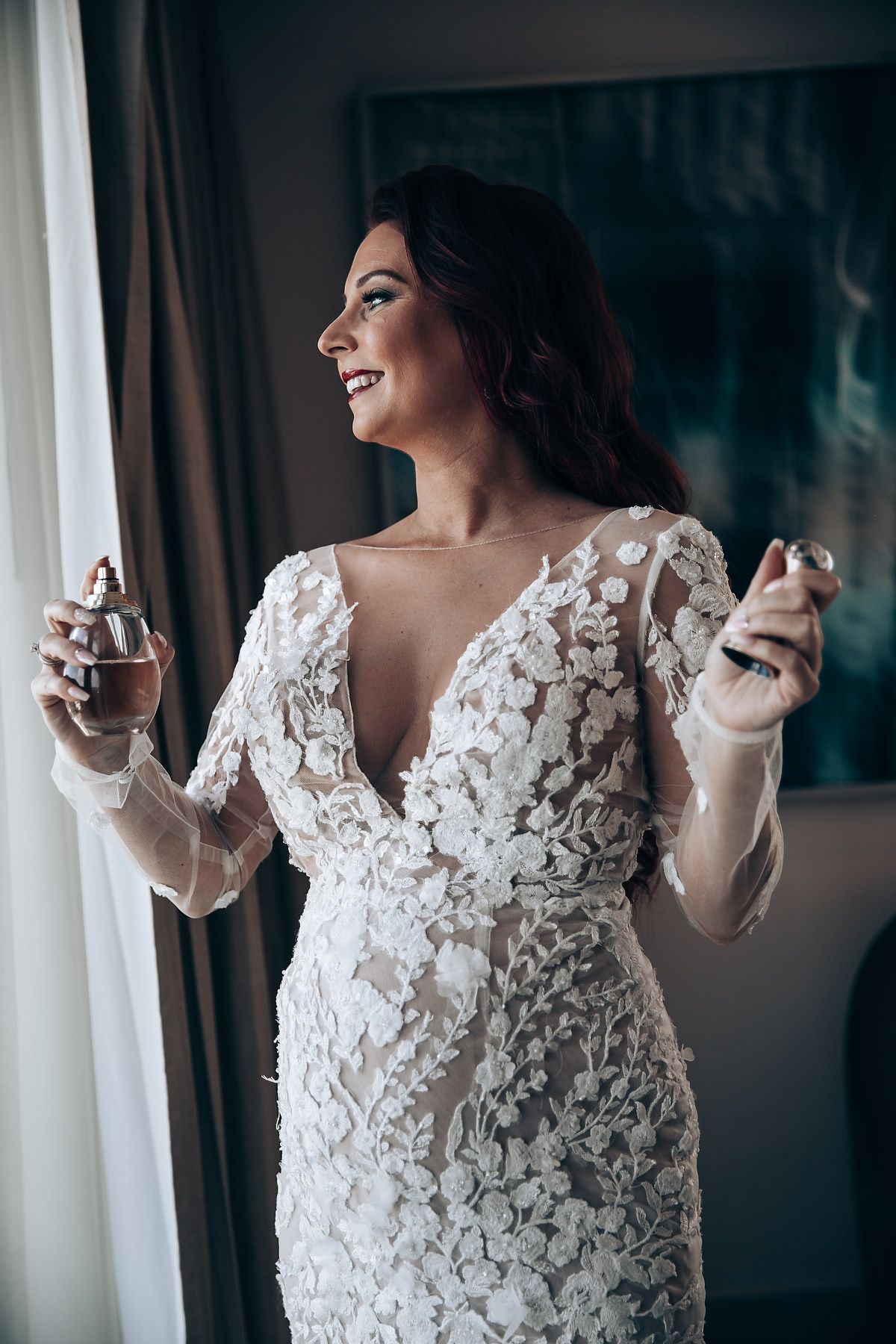 A series of photos showing a bride in a delicate white lace wedding dress posing by a window with natural light.