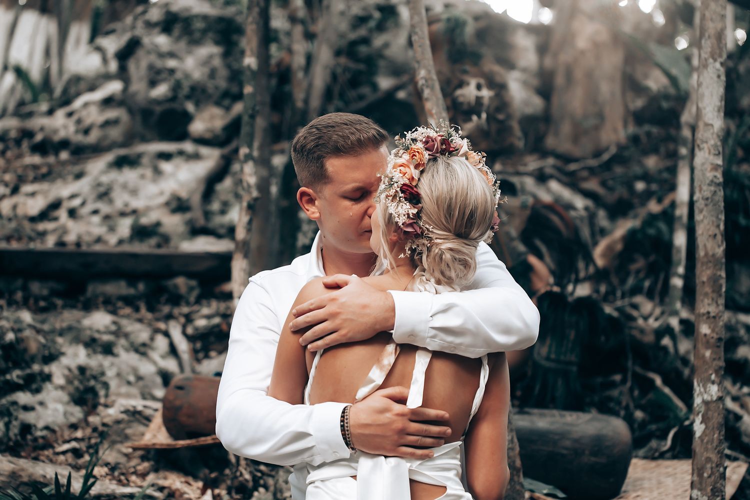 An intimate moment captured between a couple during their outdoor wedding photoshoot.