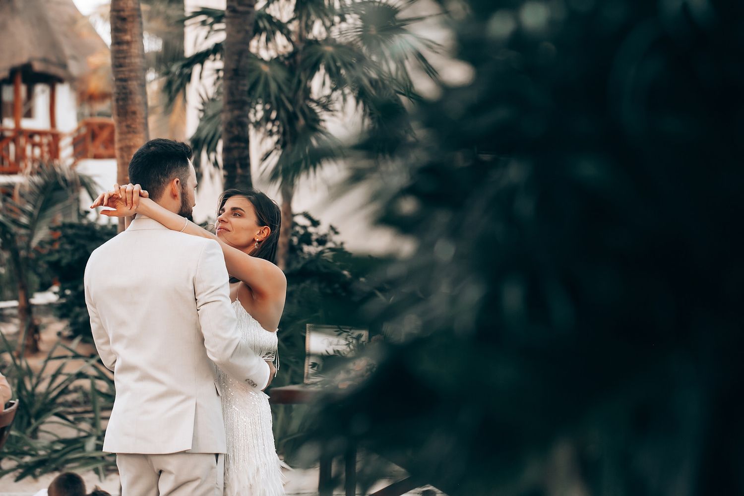 Intimate wedding moment captured in a lush garden setting with soft natural lighting.
