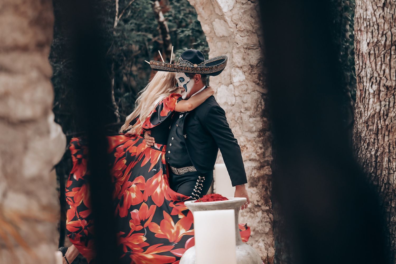 Romantic dance sequence captured in multiple frames against stone architecture and trees.