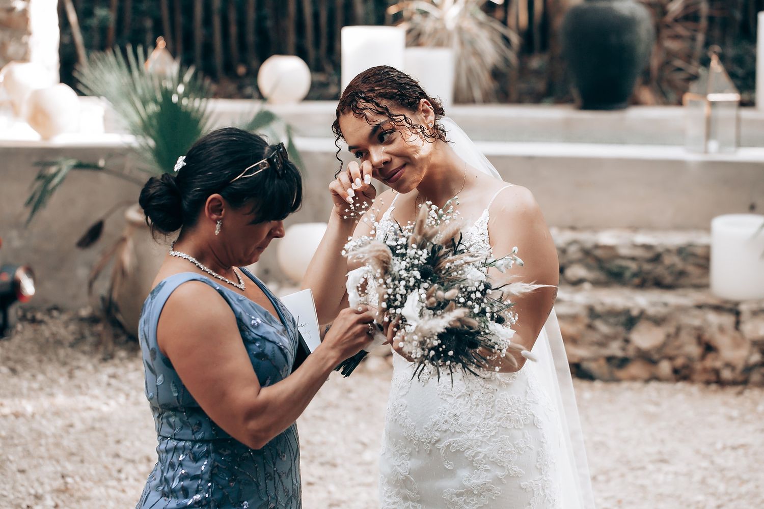 Wedding celebration in a rustic outdoor setting with natural decor.