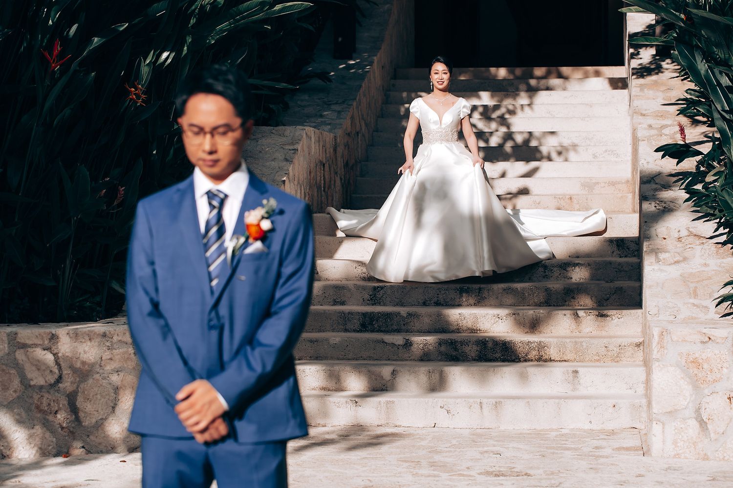 Wedding ceremony setting with elegant stone architecture and natural lighting.