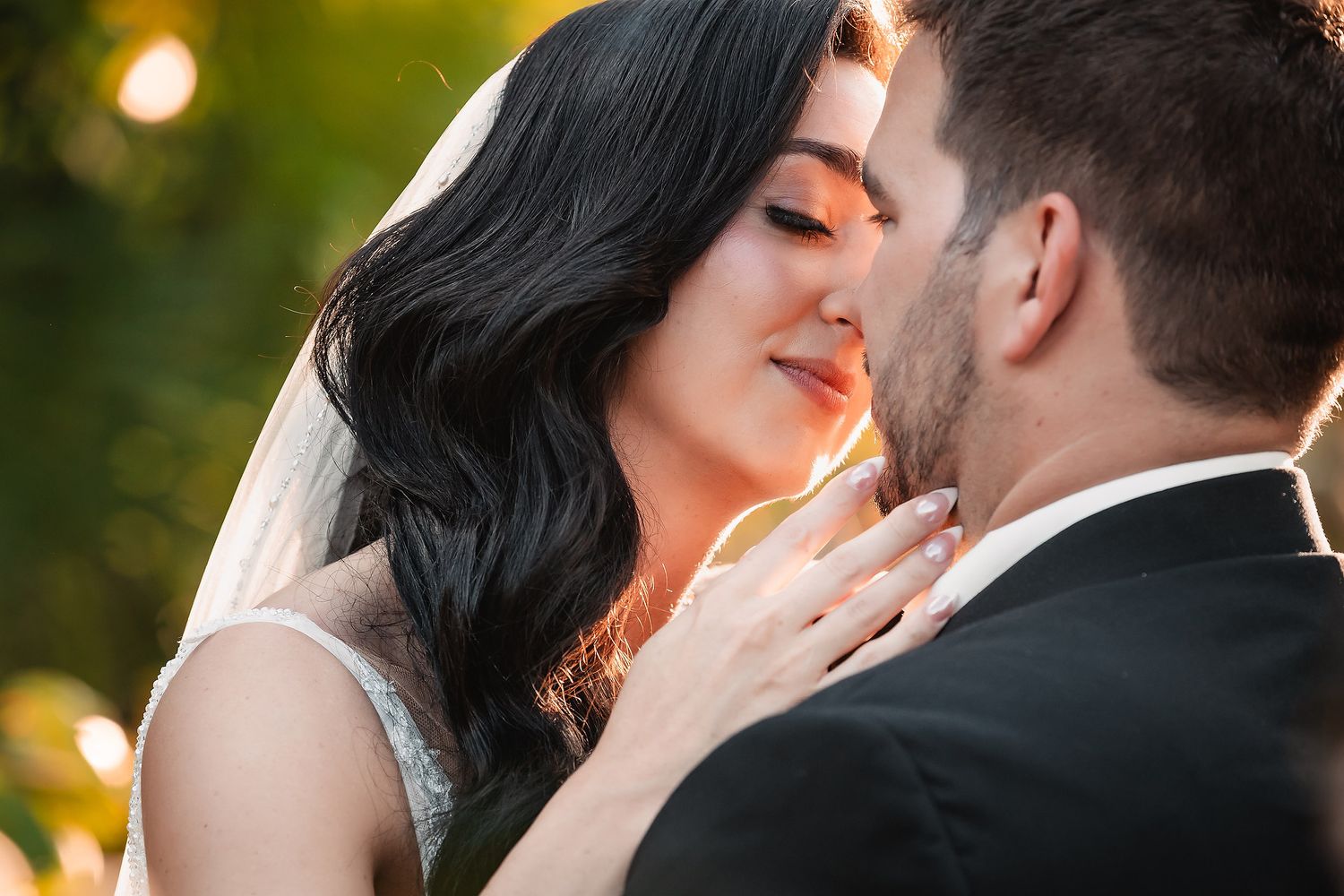 Romantic sunset wedding photos showing intimate moments between a couple against a glowing golden sky.