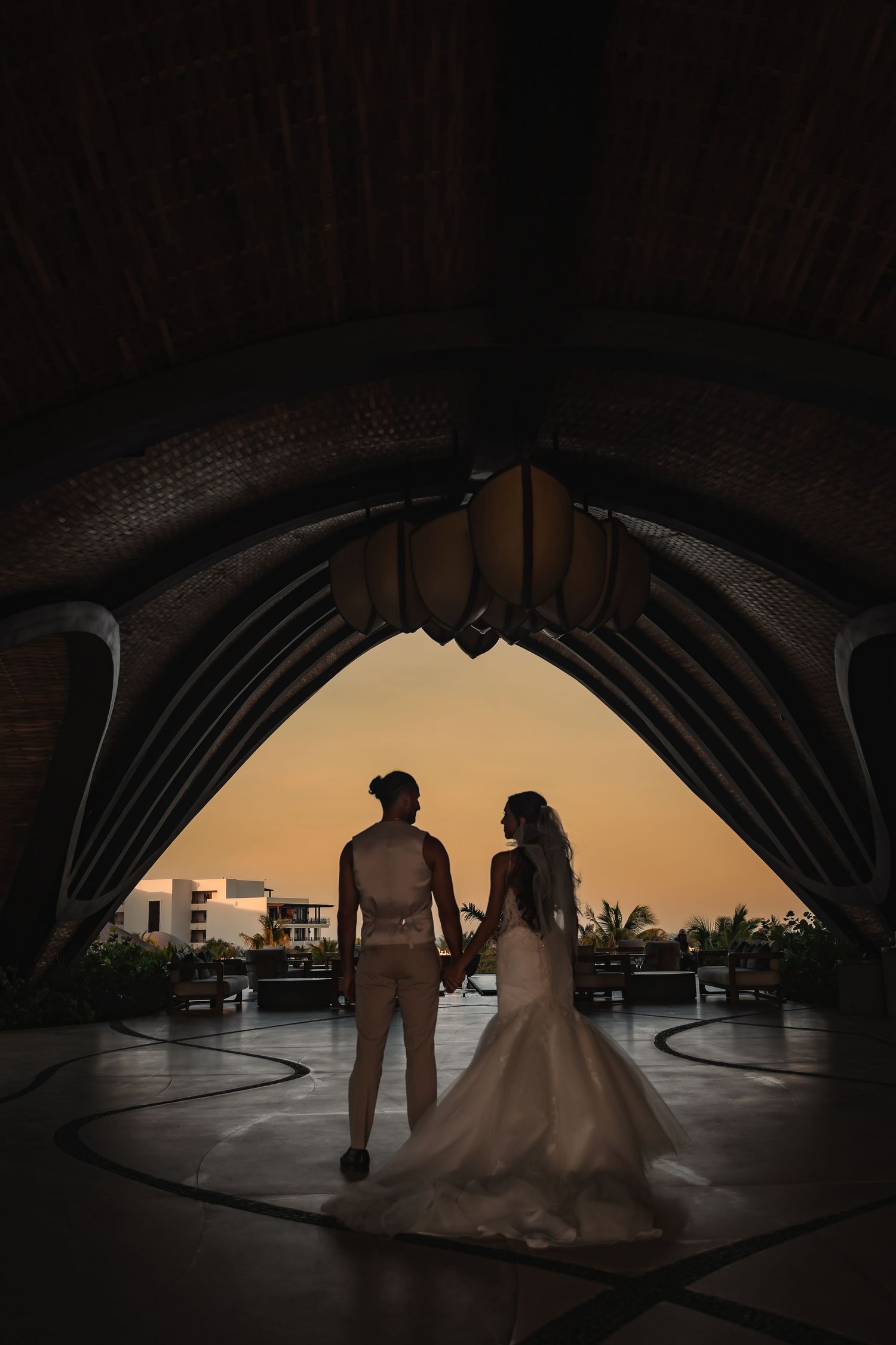 Bride and groom portrait surrounded by lush Tulum greenery