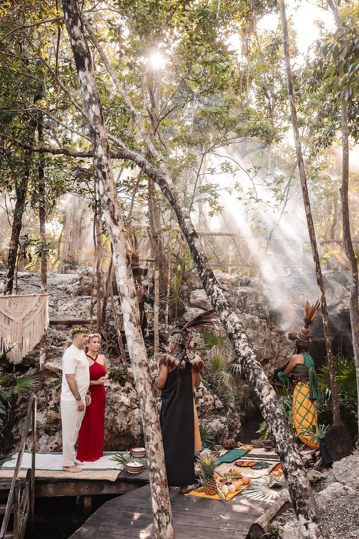Sunlit forest ceremony with traditional elements and mystical smoke effects.