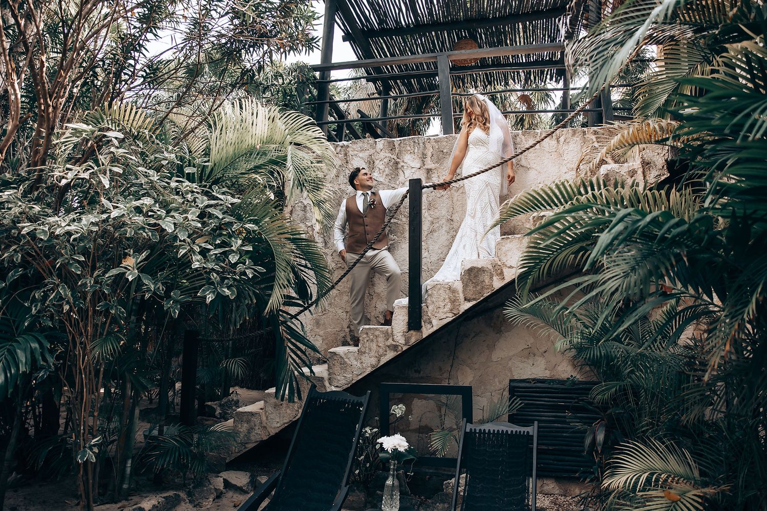 Wedding photo series capturing candid interactions in a lush garden environment.