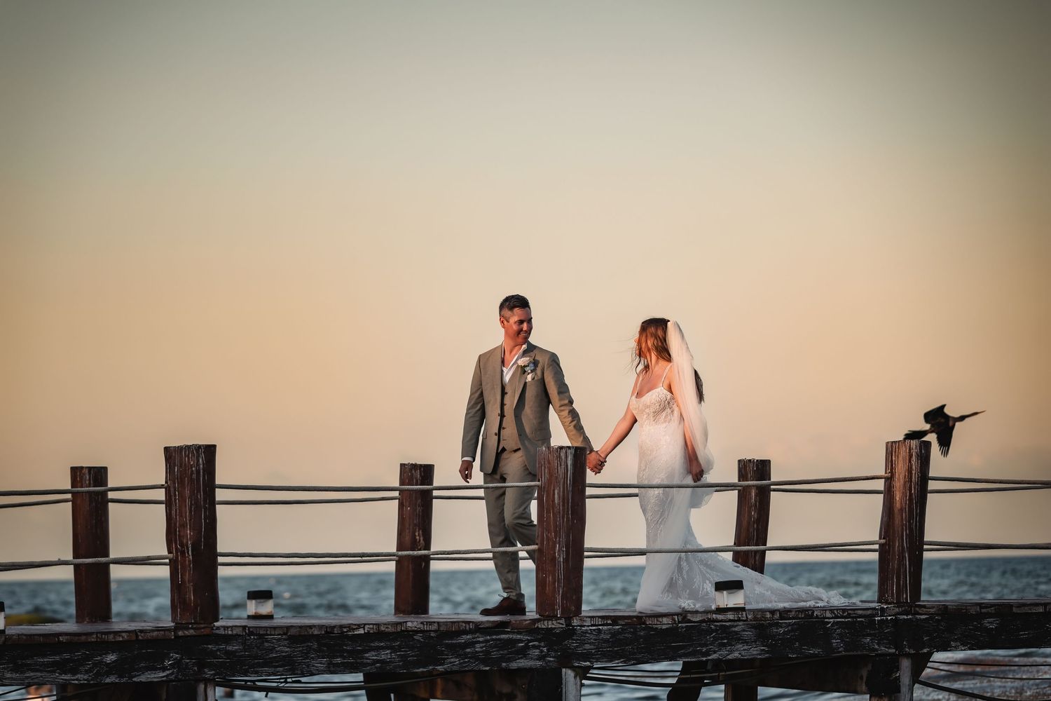 Wedding couple walking on the beach at The Fives Beach Hotel Playa del Carmen