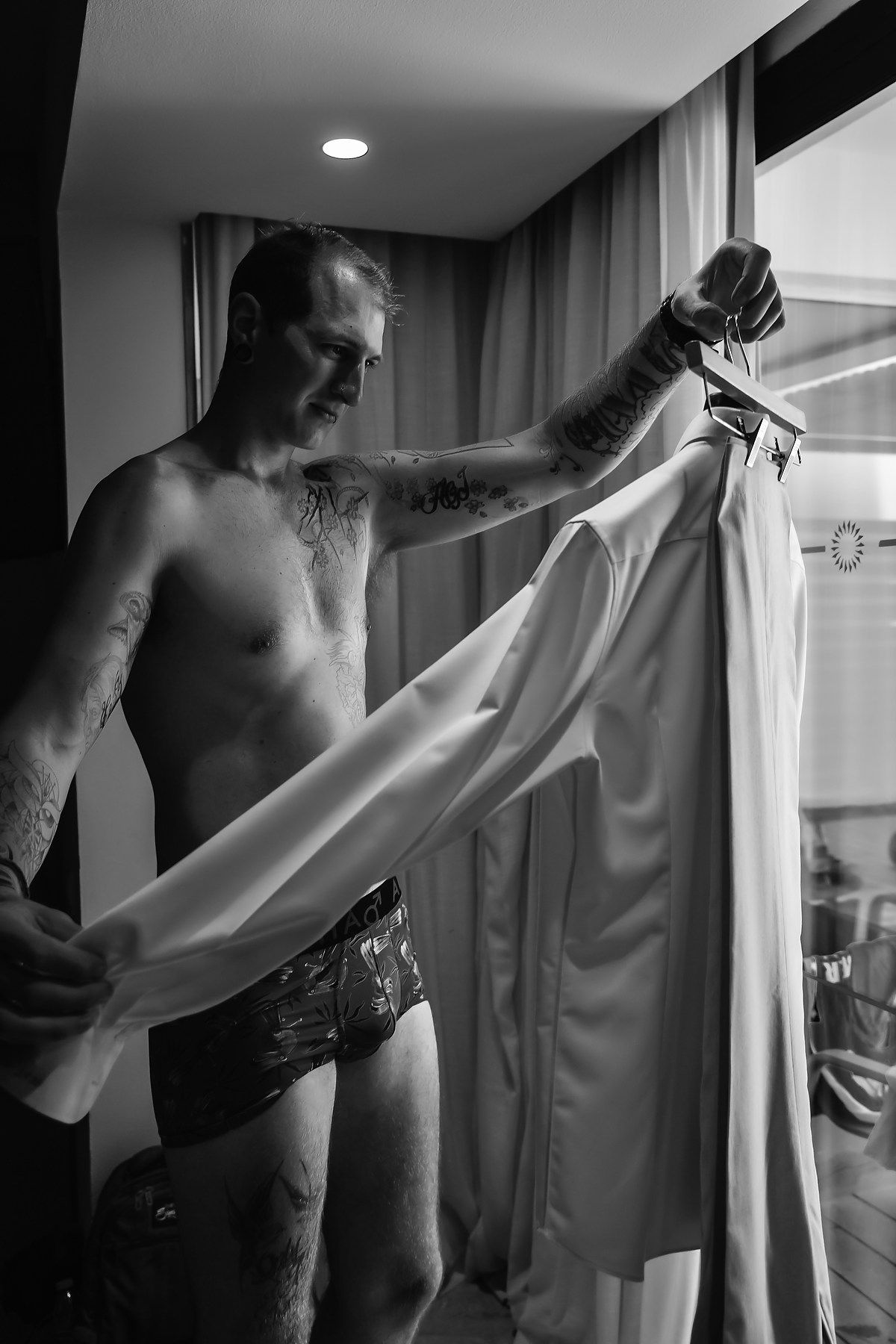 Black and white photos showing preparation of formal attire.