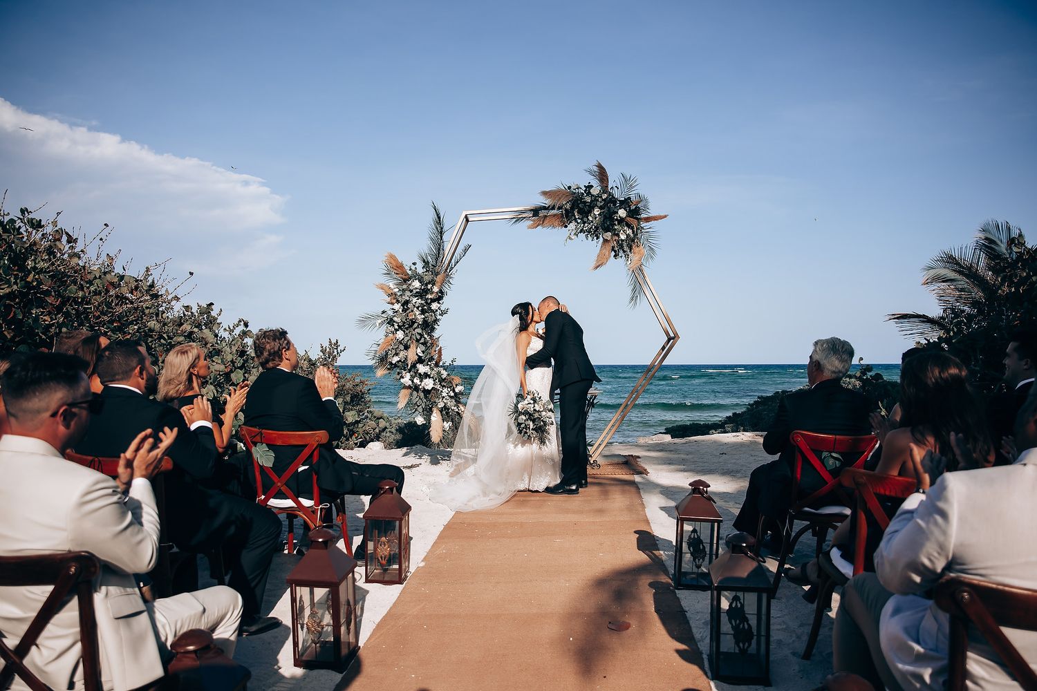 Series of beachside wedding ceremony photos showing guests celebrating under blue skies and palm trees.