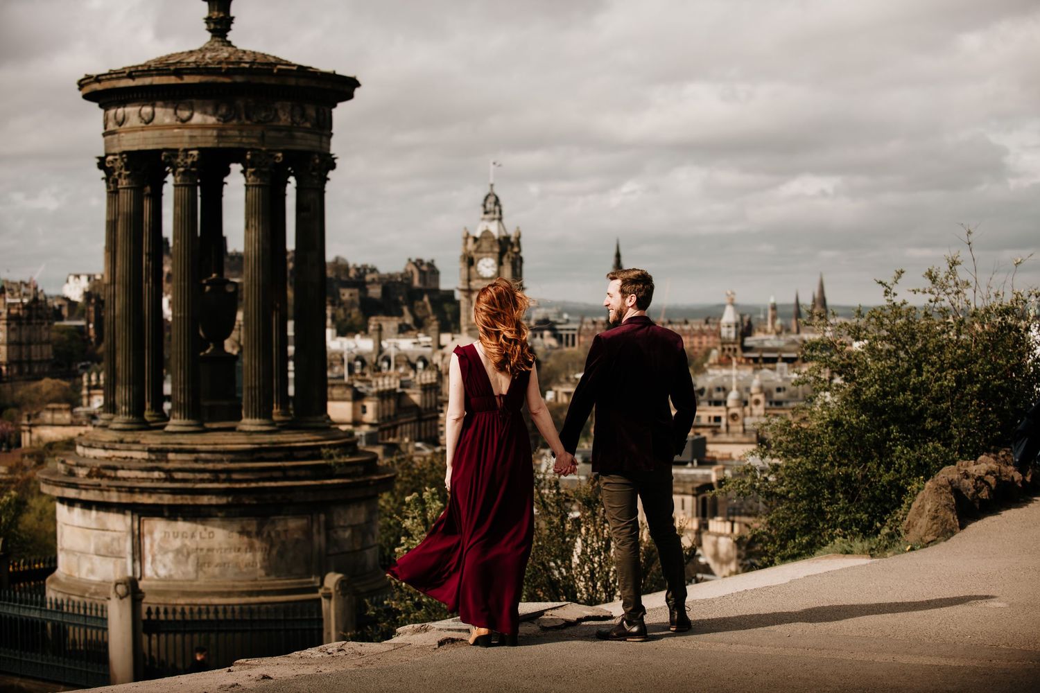 A series of romantic wedding photos captured against Edinburgh's historic cityscape and Calton Hill at sunset.
