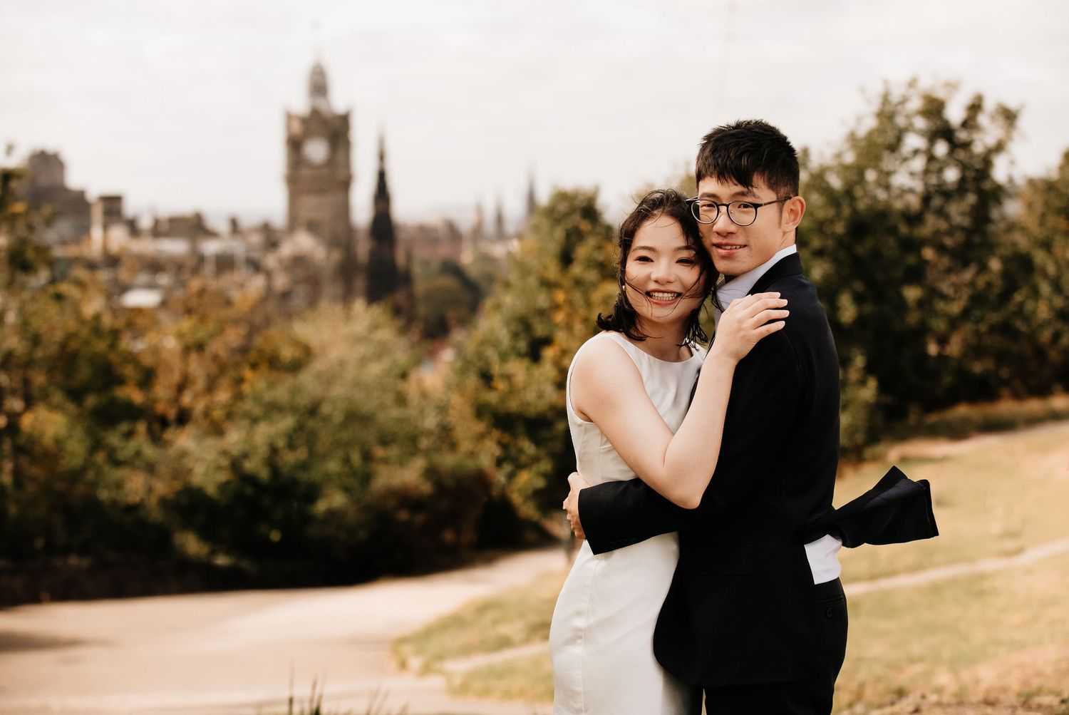 Couple sharing tender moments during their Edinburgh engagement photoshoot.