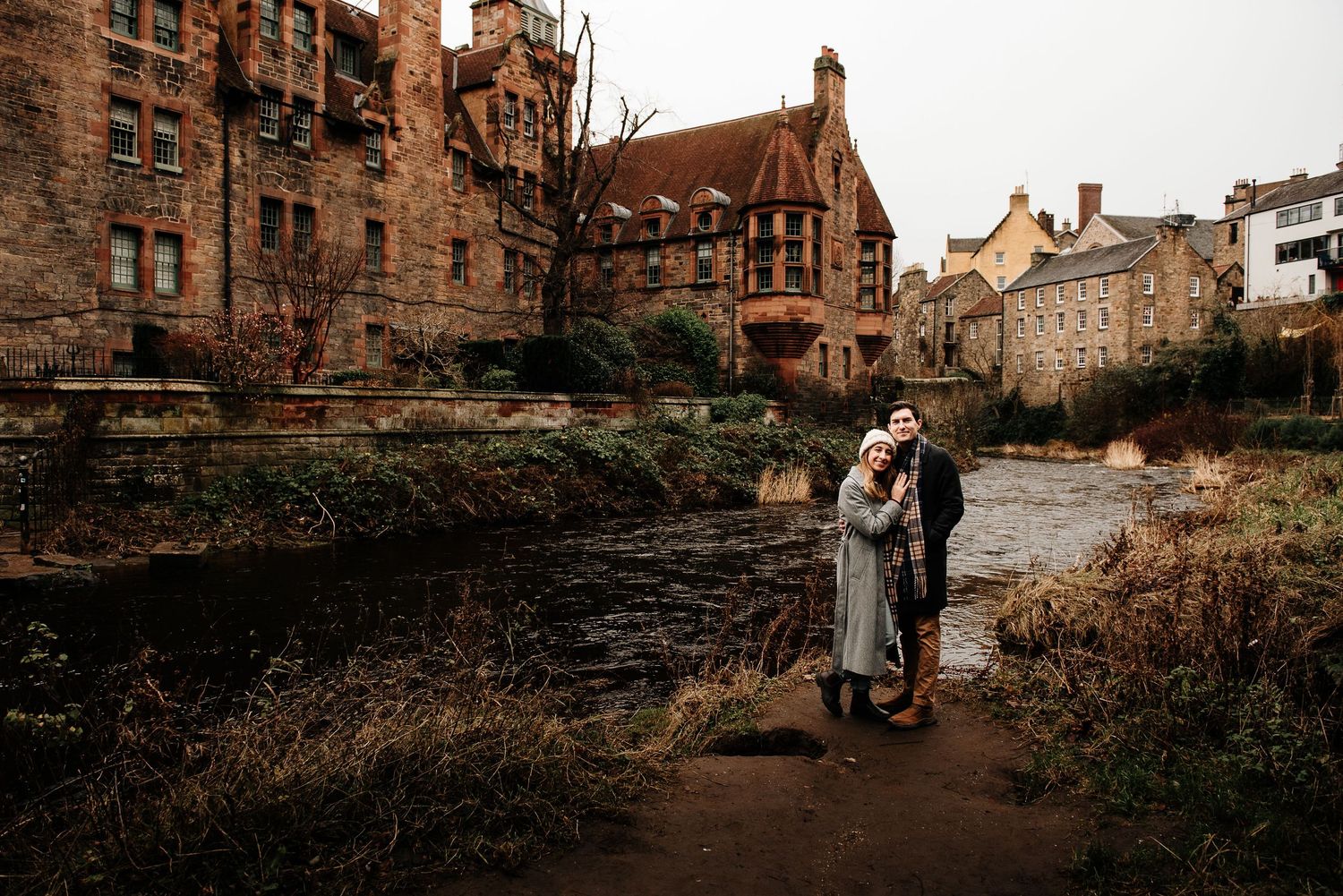 Historic stone buildings and architecture line a scenic pathway in an old European neighborhood.