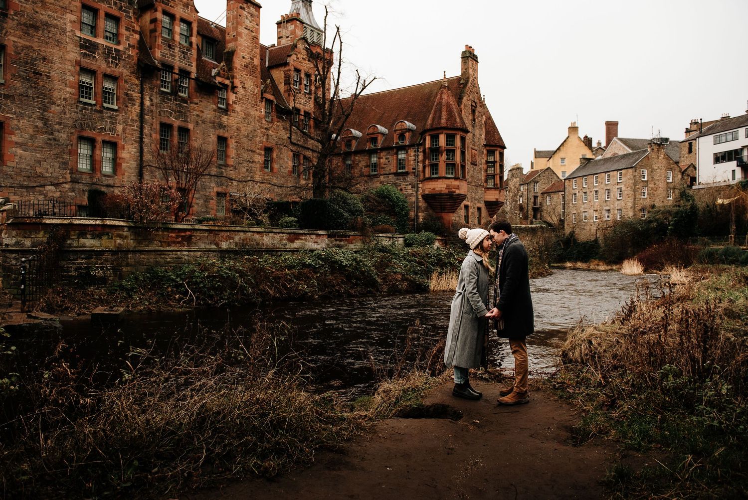 Historic stone buildings and architecture create a dramatic backdrop for an outdoor photoshoot.