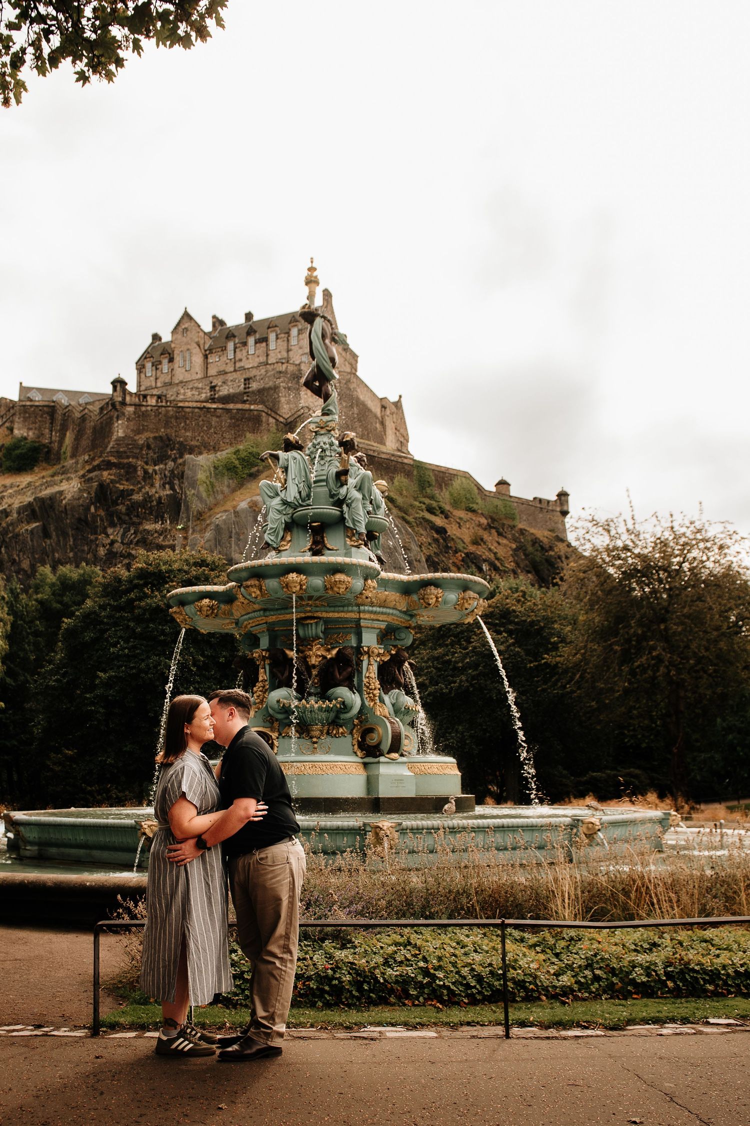Romantic moment by Ross Fountain with Edinburgh Castle looming on the hill above.