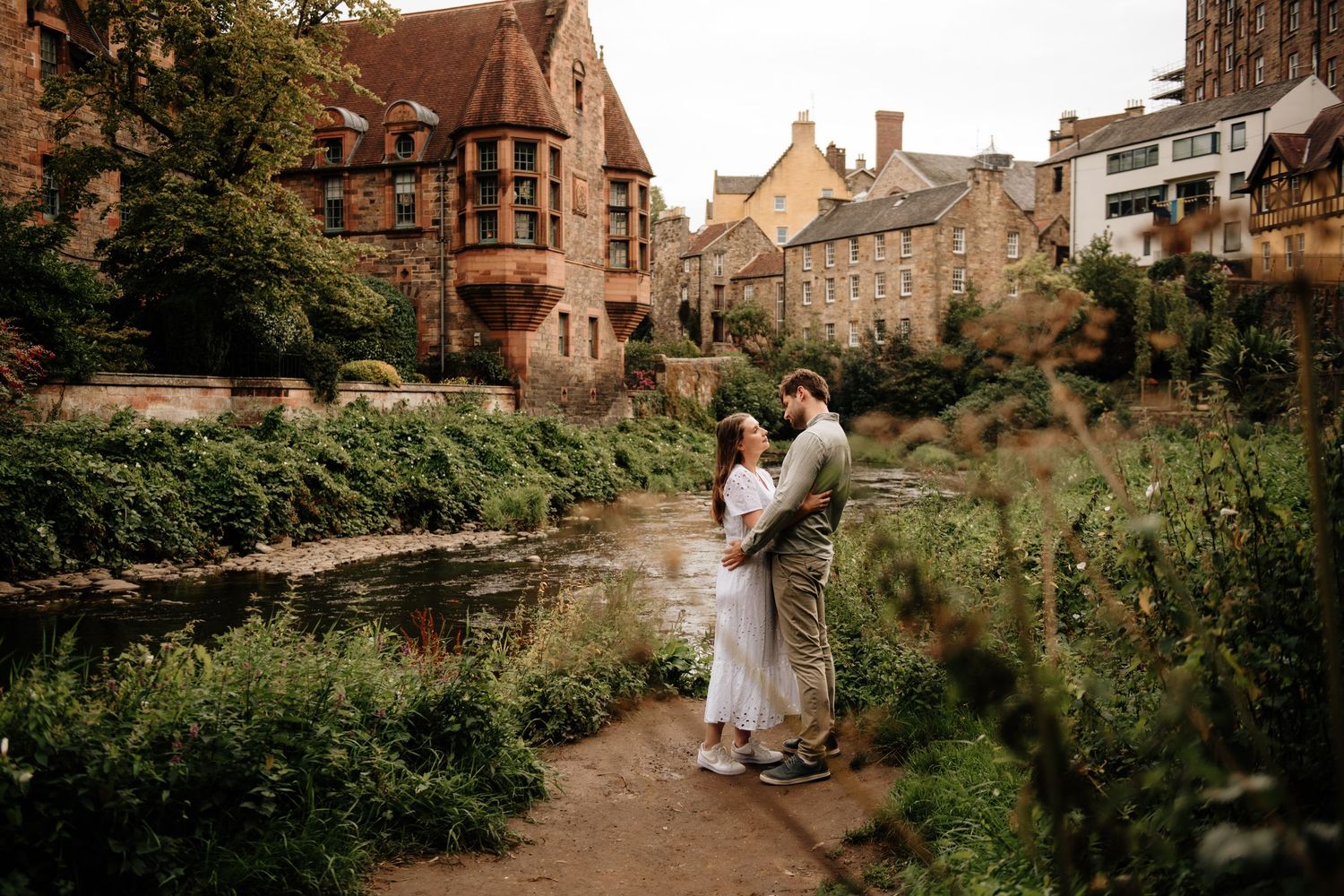 Wedding photography session along charming historic streets with stone buildings.