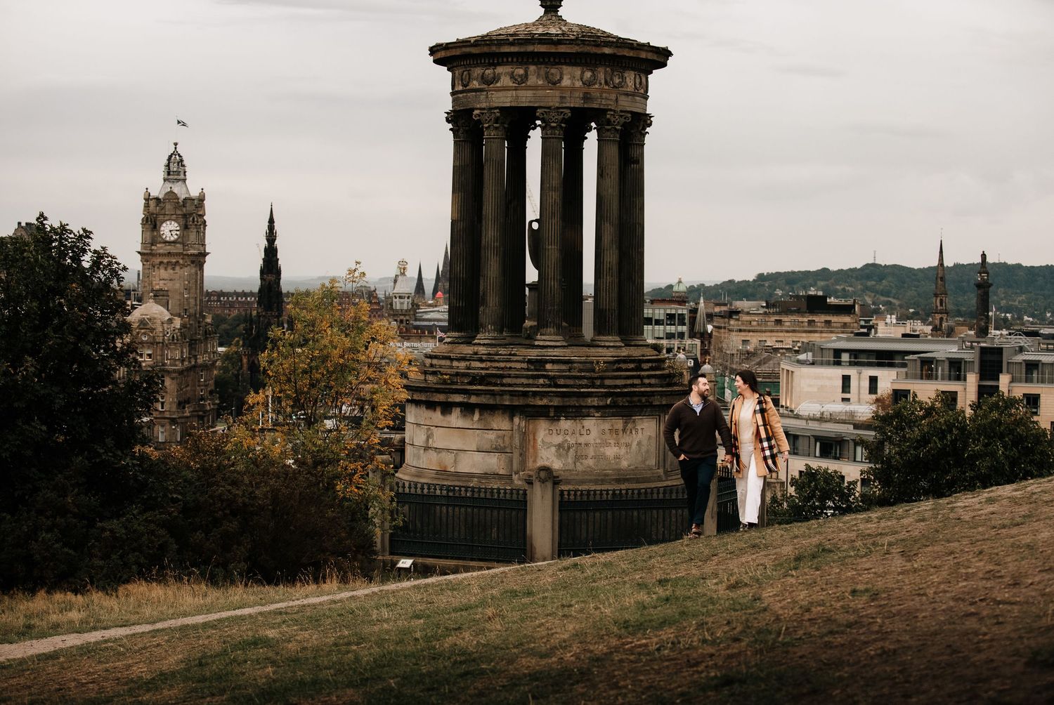 Panoramic view of Edinburgh's historic monuments and architecture on Calton Hill.