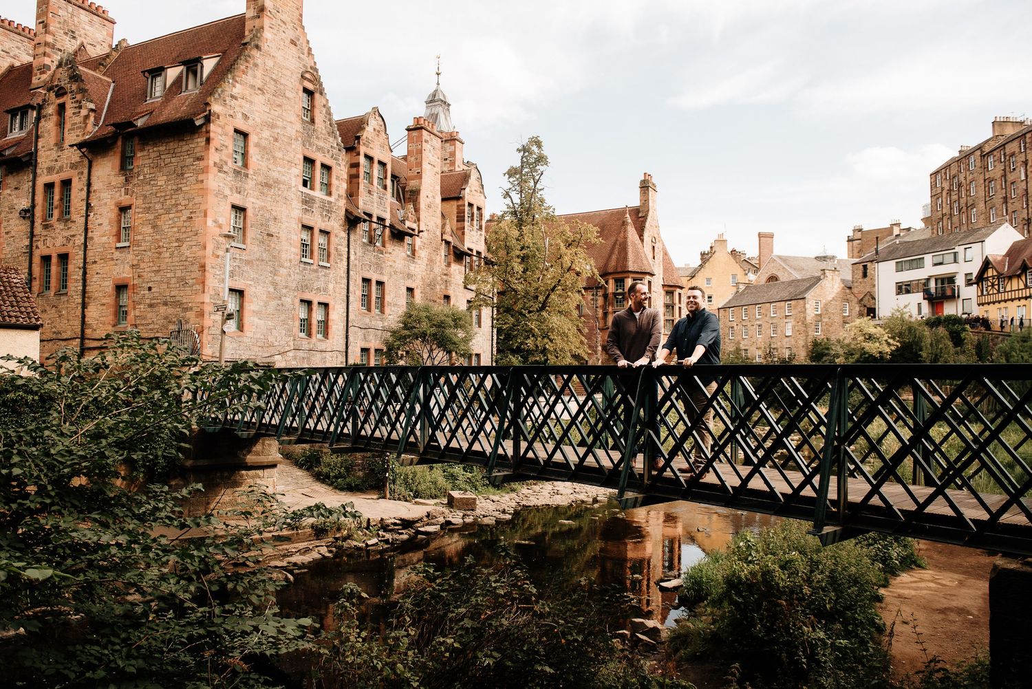 Panoramic view of Dean Village in Edinburgh with its iconic architecture and iron footbridge.
