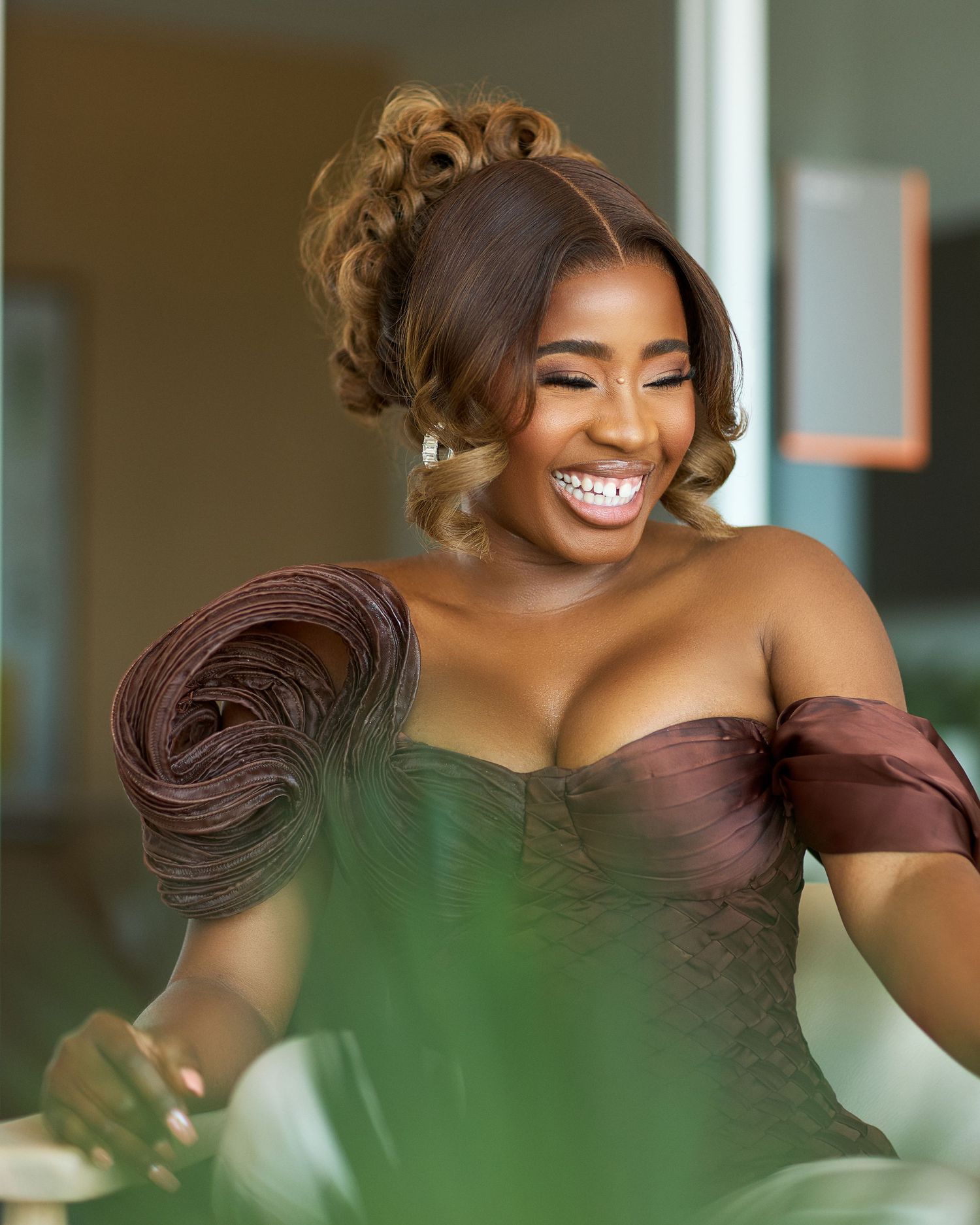 Portrait series showing elegant brown dress with off-shoulder design.