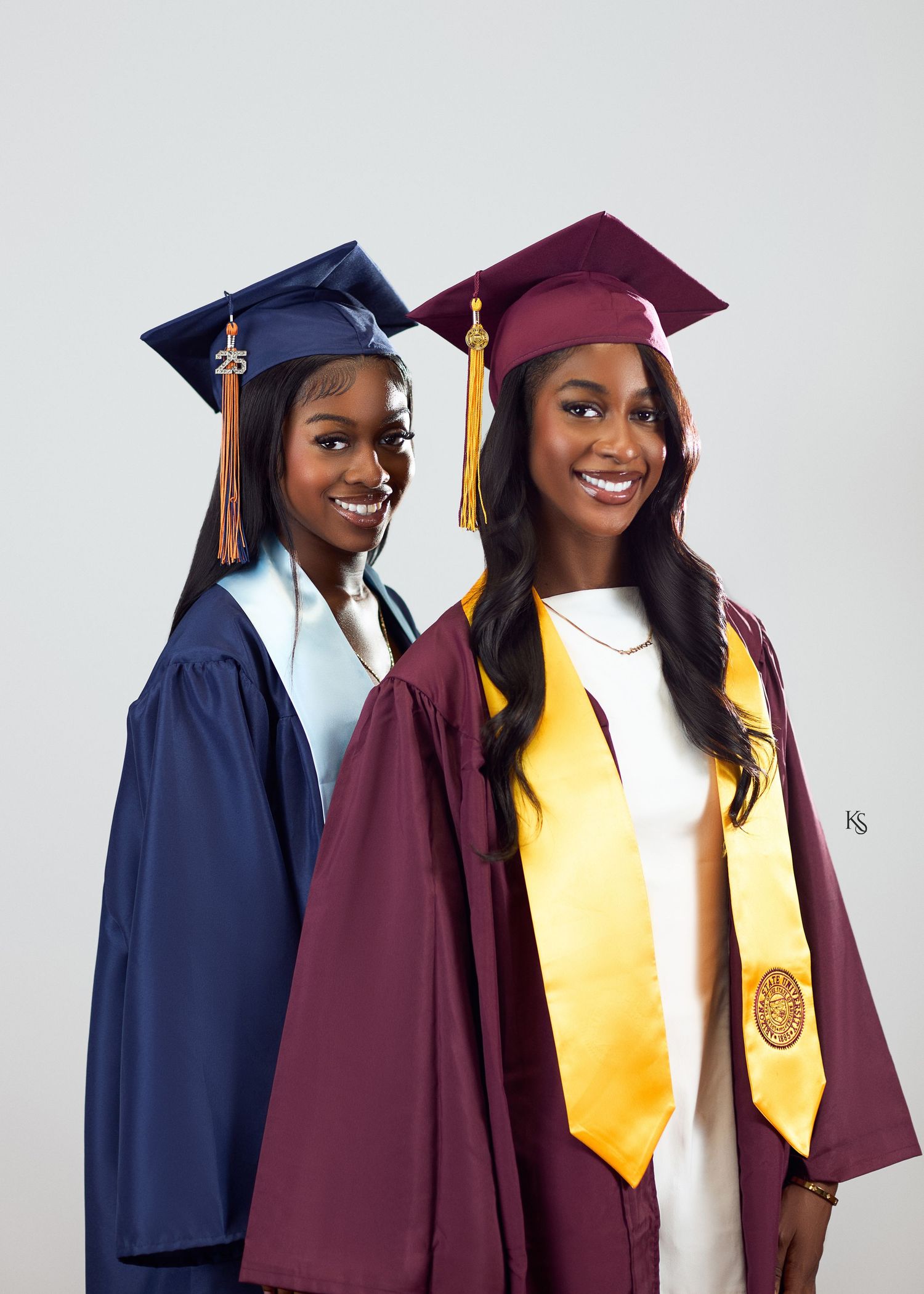 Graduation portraits showing students in caps and gowns with colored stoles.