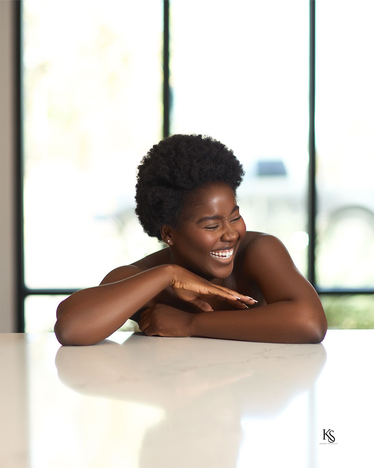 Natural light portrait series with joyful expressions and bare shoulders.
