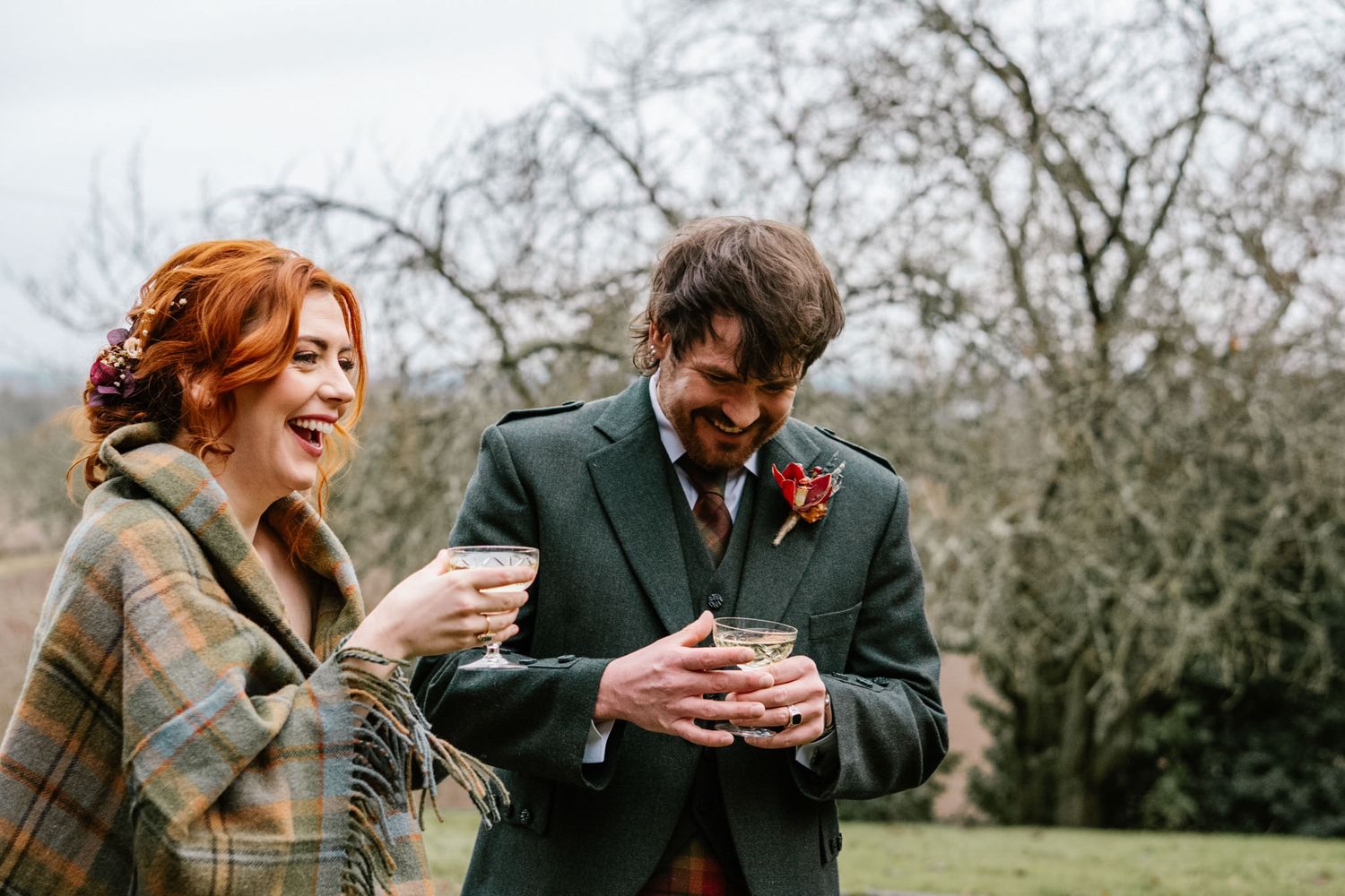 Joyful moments captured during a Scottish-themed wedding celebration outdoors.