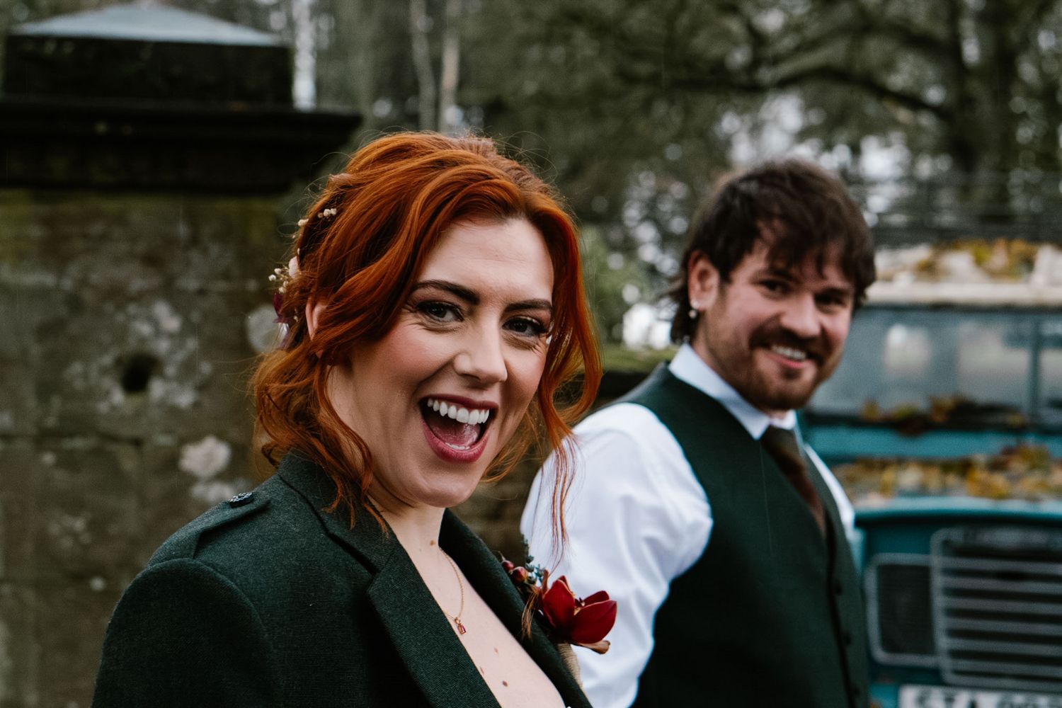 Candid wedding moments captured against a rustic stone building backdrop.