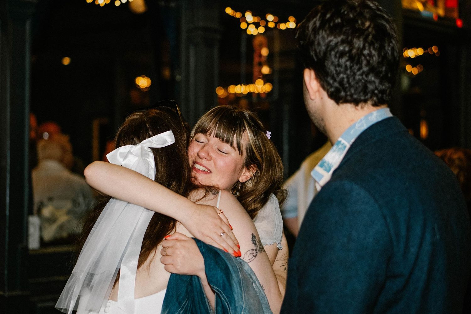 Intimate dance moments captured during an evening wedding reception with warm lighting.