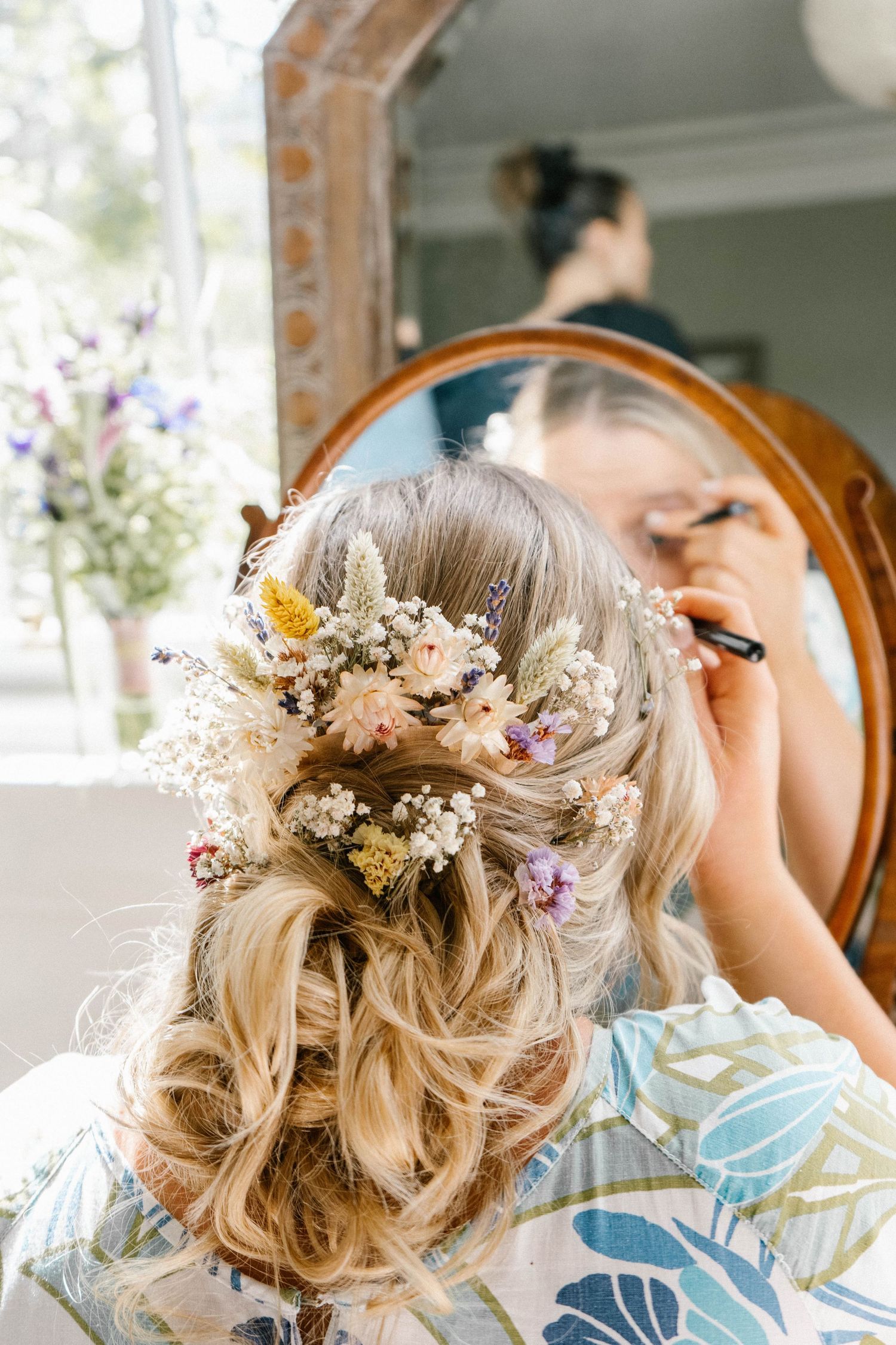 Delicate floral hair accessories and styling details for a wedding.