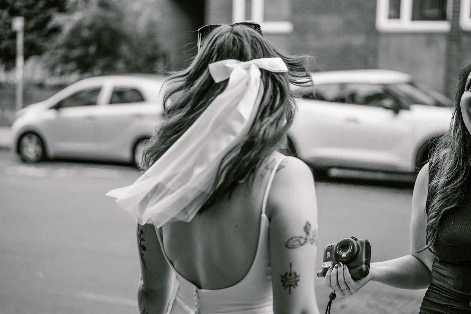 Outdoor black and white wedding photography sequence showing movement and joy.