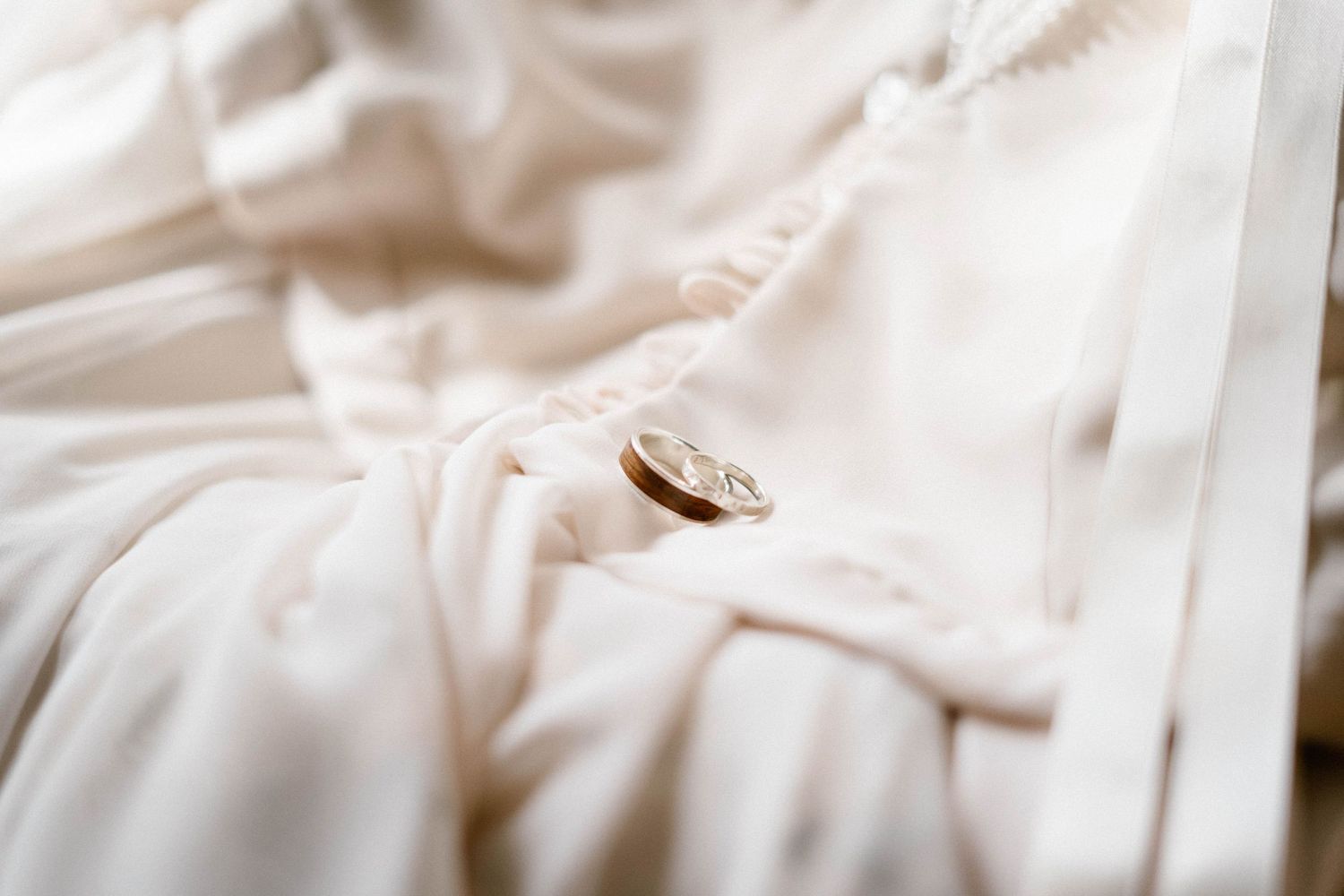 Close-up of soft white fabric with gentle folds and texture.