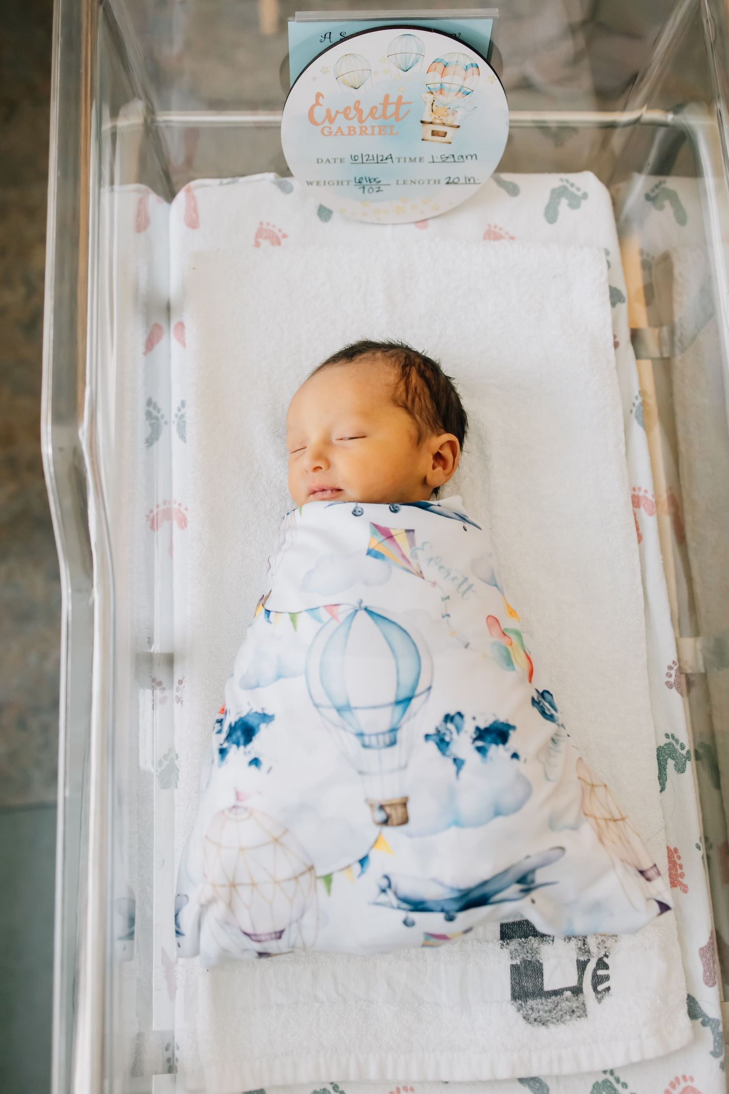 Portrait photography of a newborn in a hospital bassinet