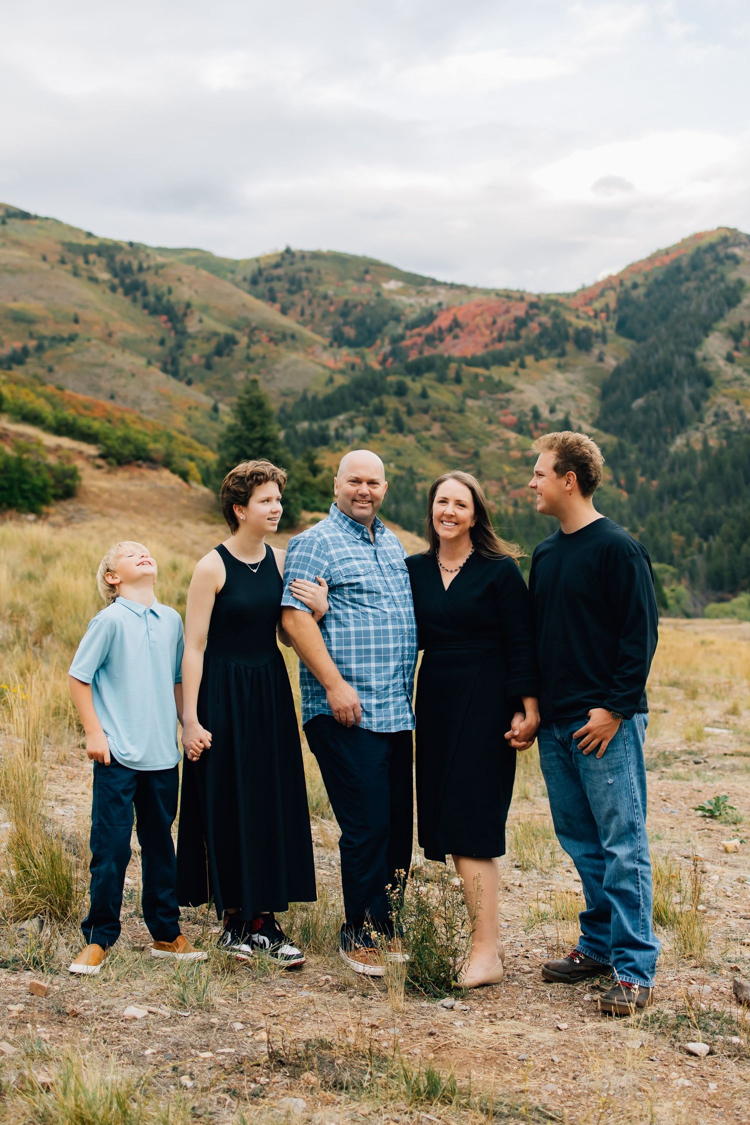 Family photography of a small family in the stunning landscape of Tibble Fork Reservoir