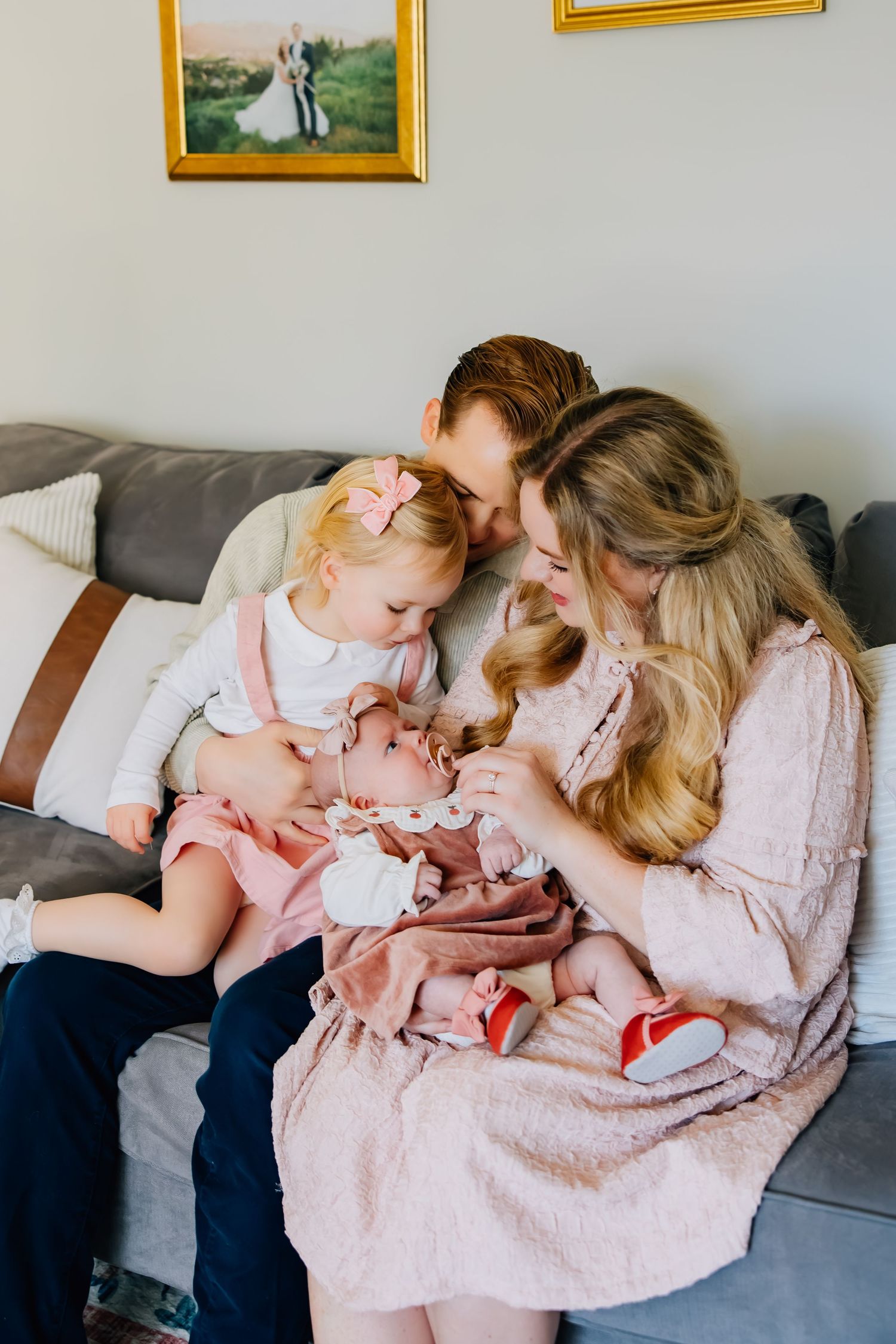 Lifestyle newborn photography of a small family in their infant's nursery