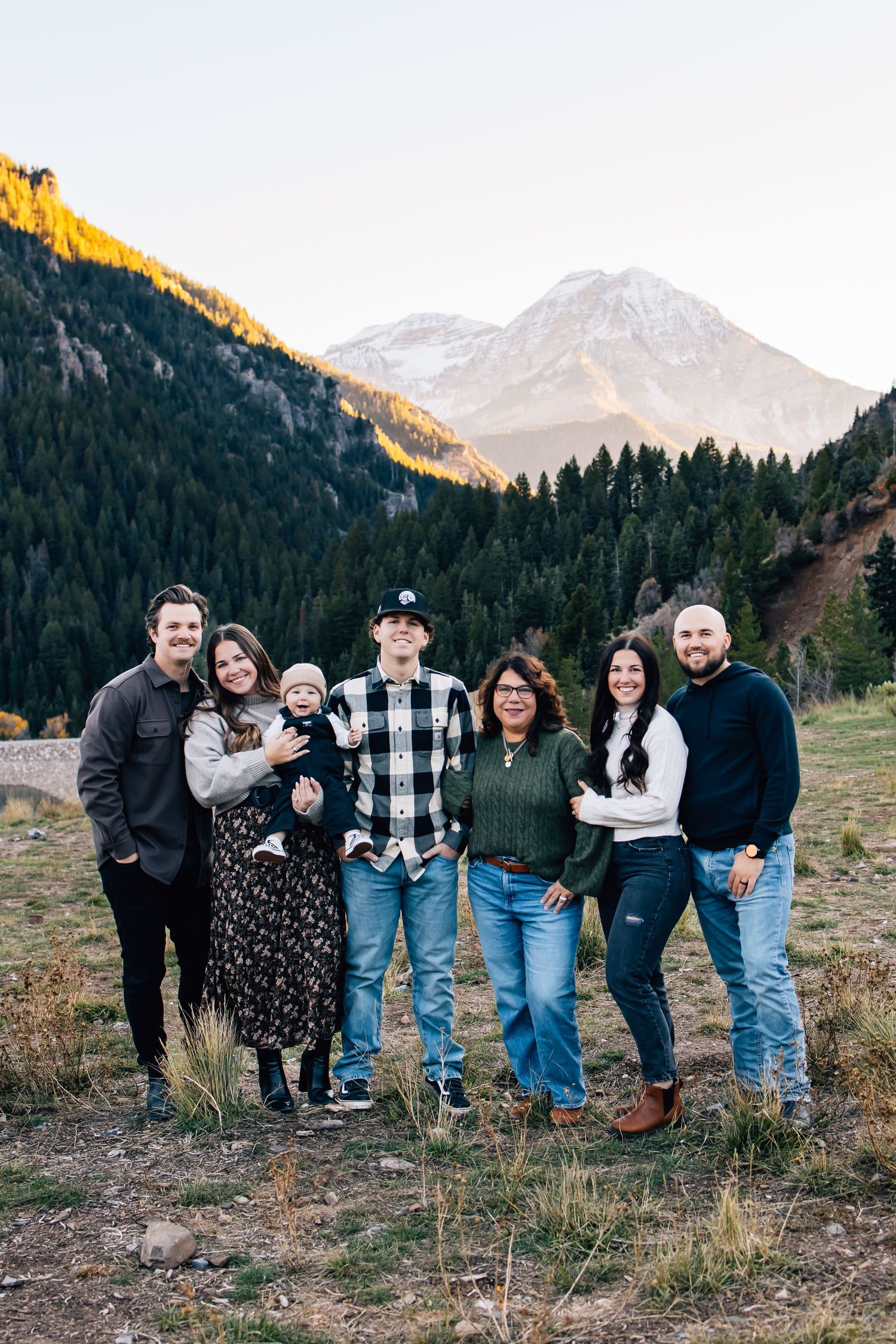 Family photography of a small family in the stunning landscape of Tibble Fork Reservoir