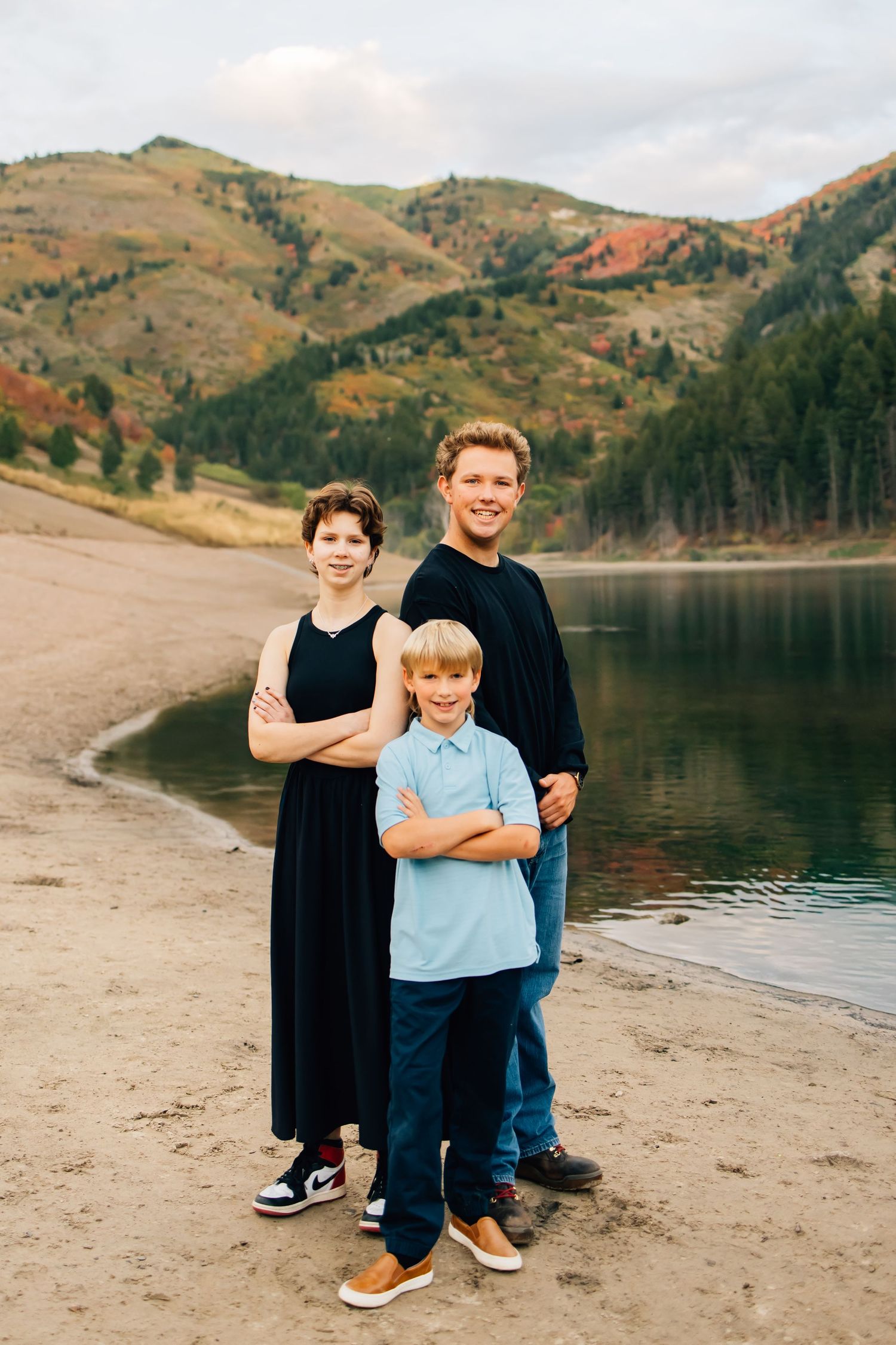 Family photography of a small family in the stunning landscape of Tibble Fork Reservoir