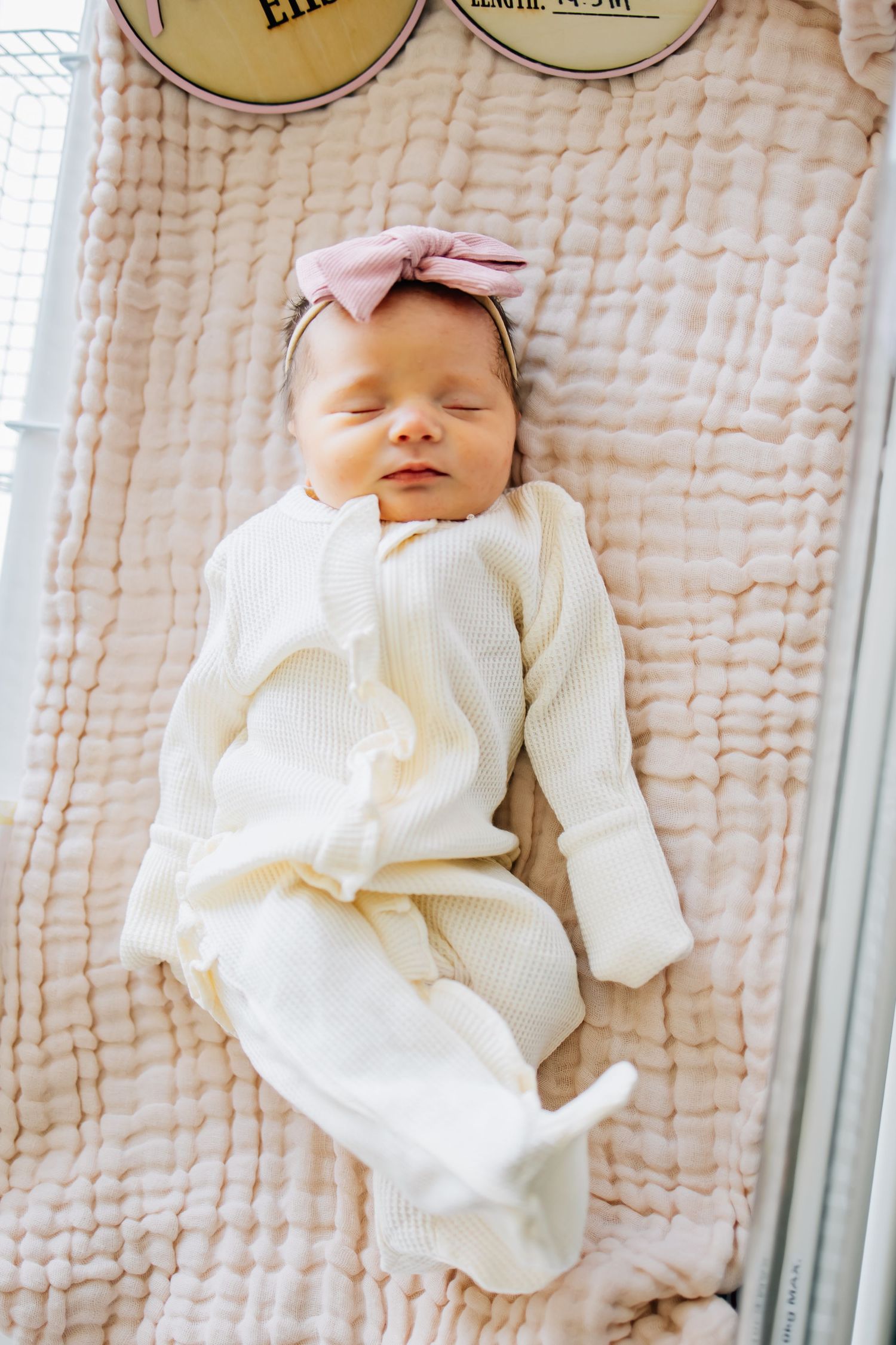 Portrait photography of a newborn in a hospital bassinet