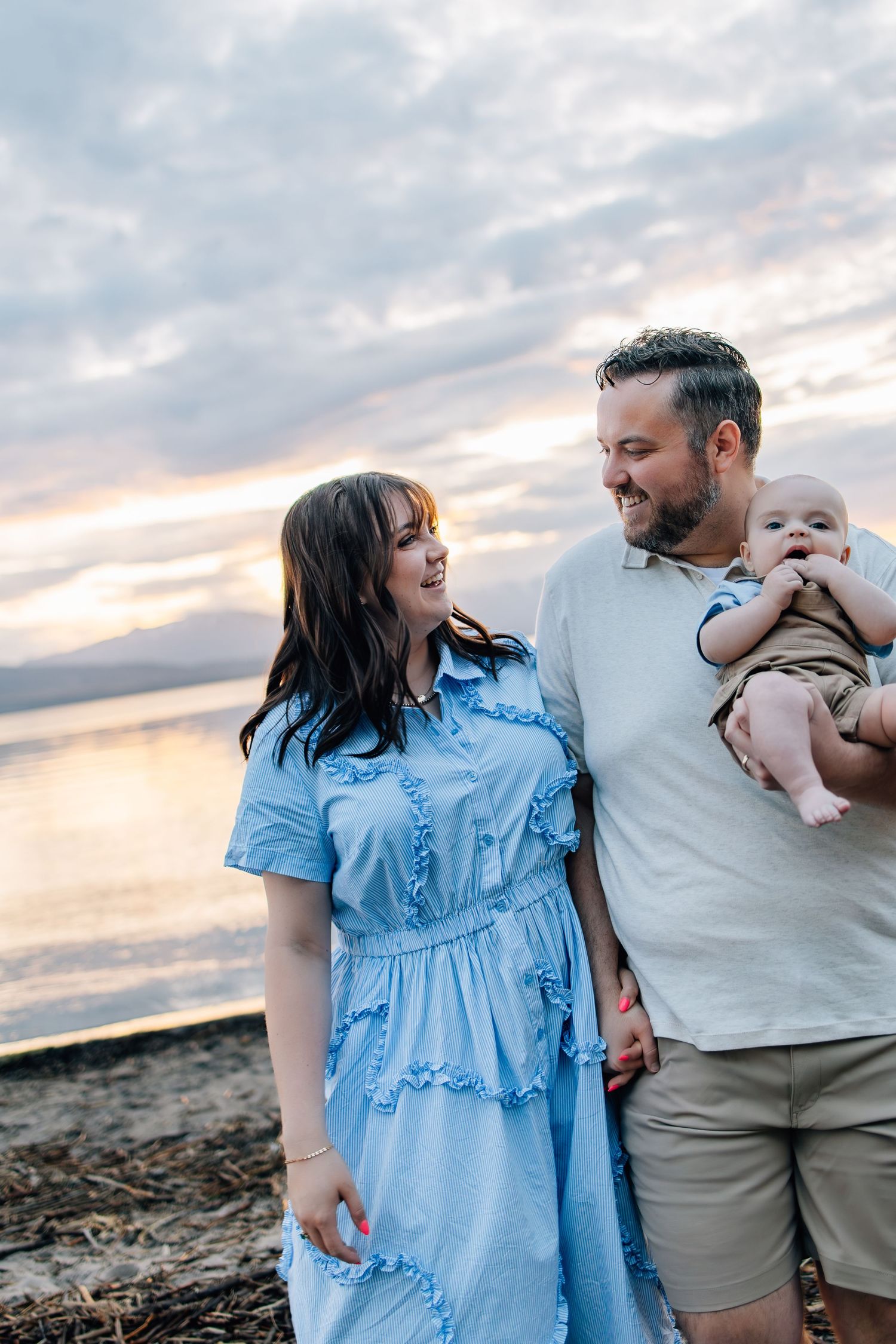Family photography featuring a mother in a stunning baby blue dress in a Utah lake setting