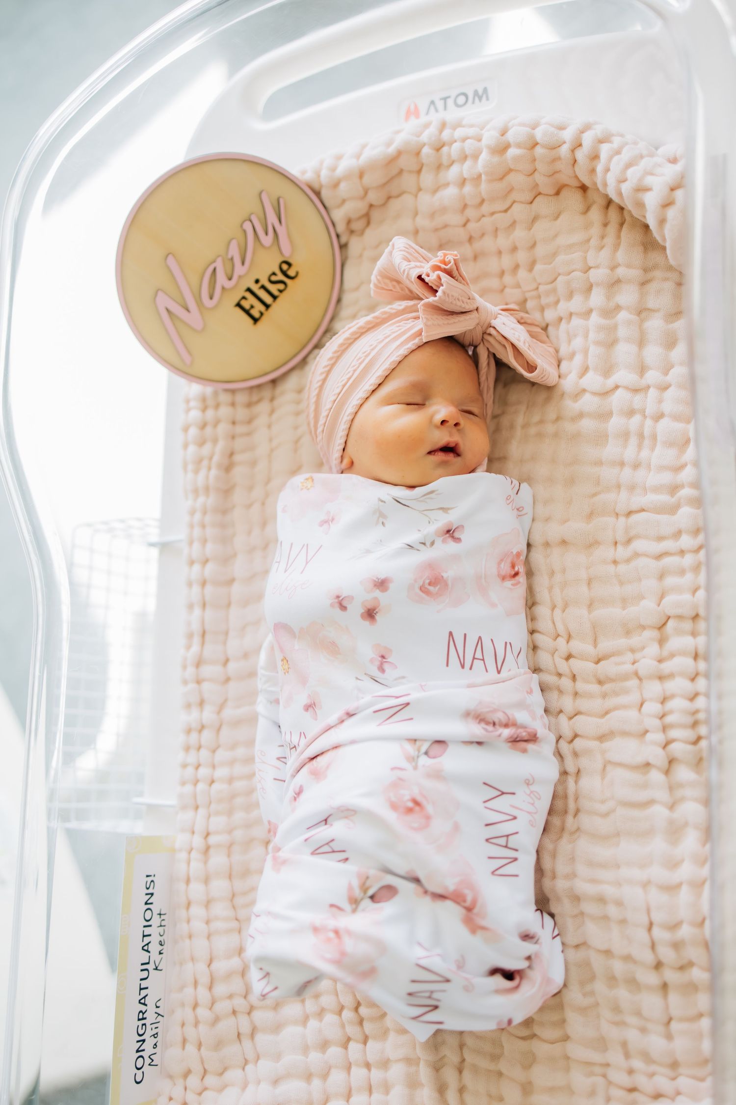 Portrait photography of a newborn in a hospital bassinet