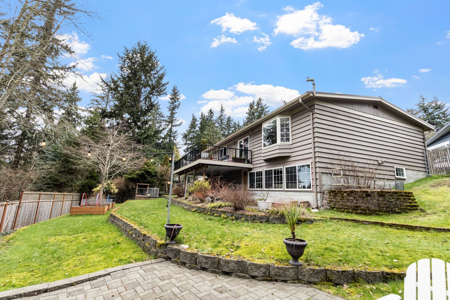 real estate photo exterior back of house, deck, and patio