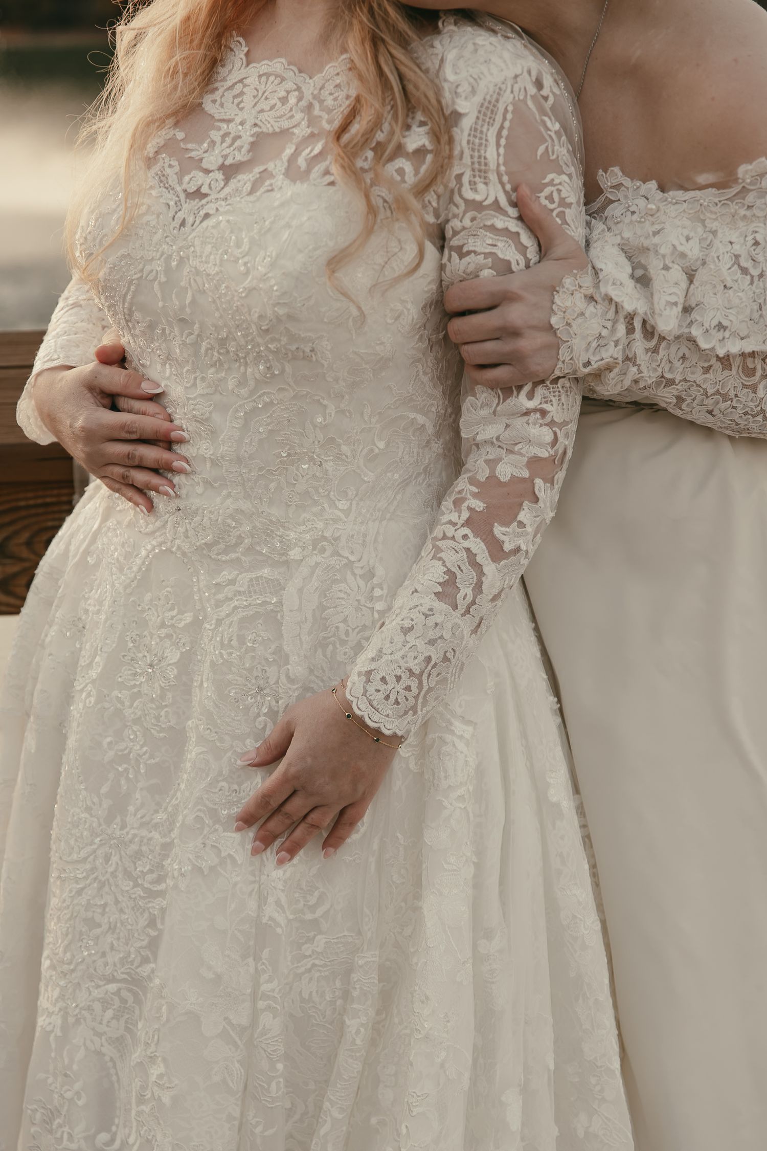 Detail shots of two wedding dresses with intricate lace patterns in Lake County by Gypsy Lens Photography. Moody, intimate, wedding.