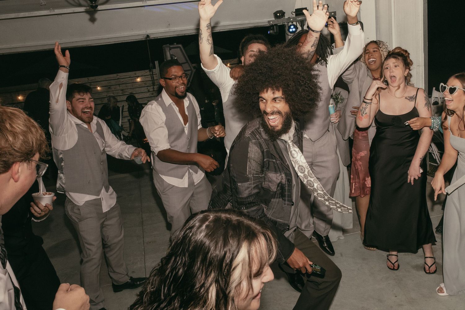 Lively dancing reception on wedding day in Cleveland Ohio by Gypsy Lens Photography. Moody, vintage, documentary wedding photography.
