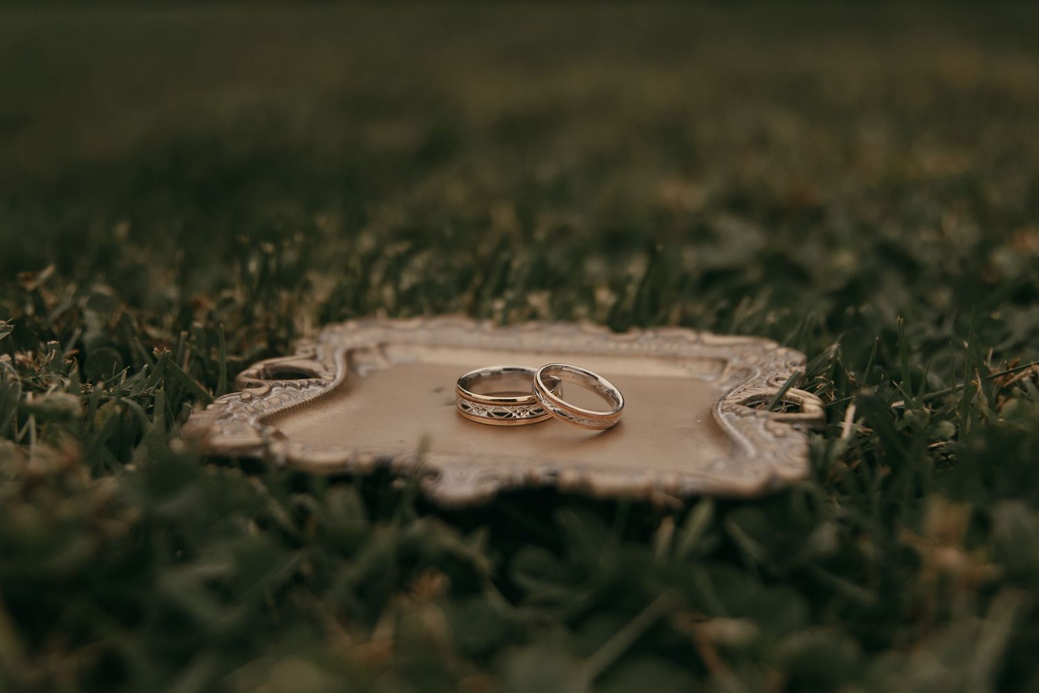 Wedding ring detail photo in Ashtabula Ohio by Gypsy Lens Photography. Moody, vintage, documentary wedding photography.