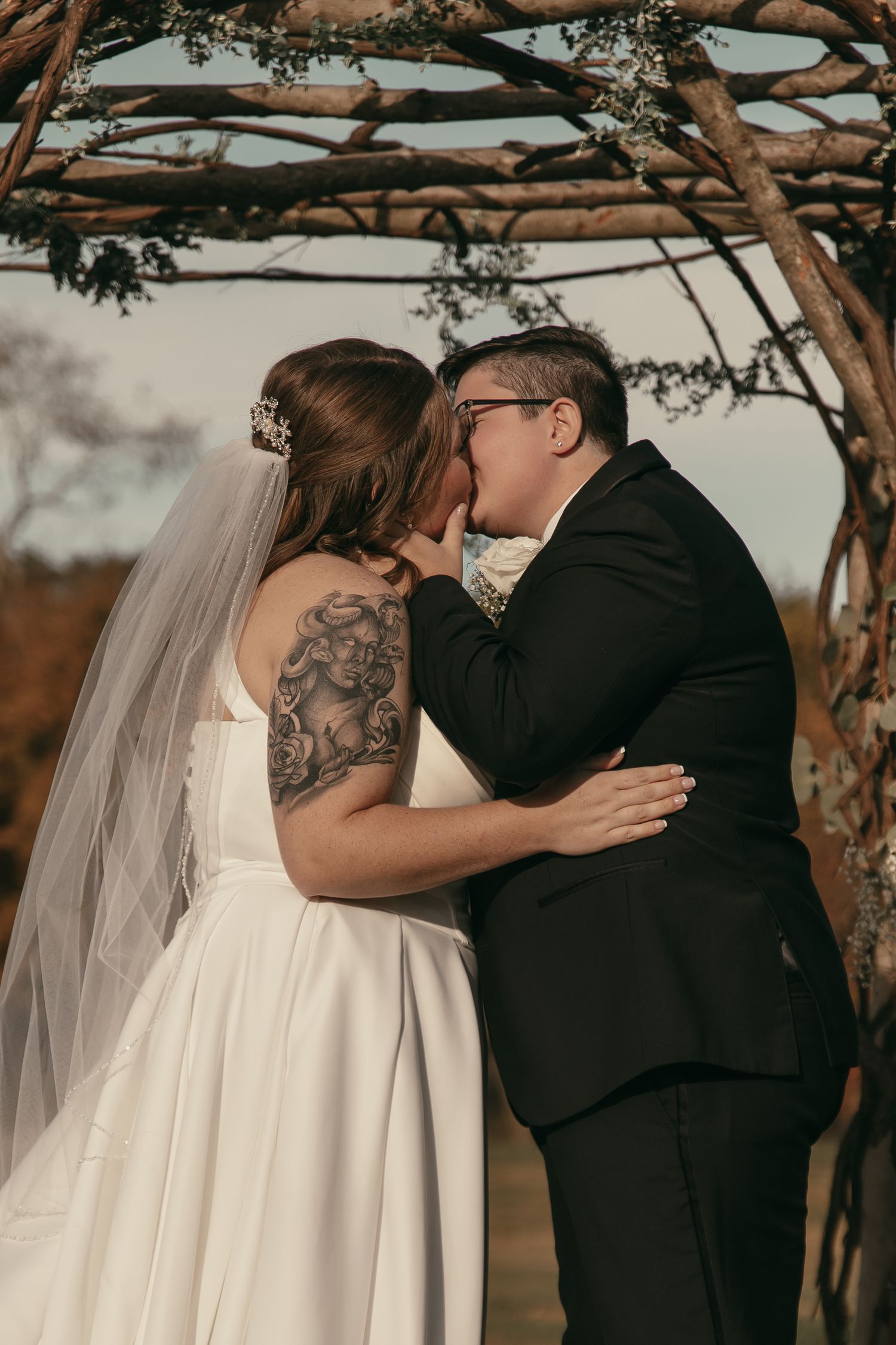 Emotional first kiss between brides in Cleveland Ohio by Gypsy Lens Photography. Moody, vintage, documentary wedding photography.