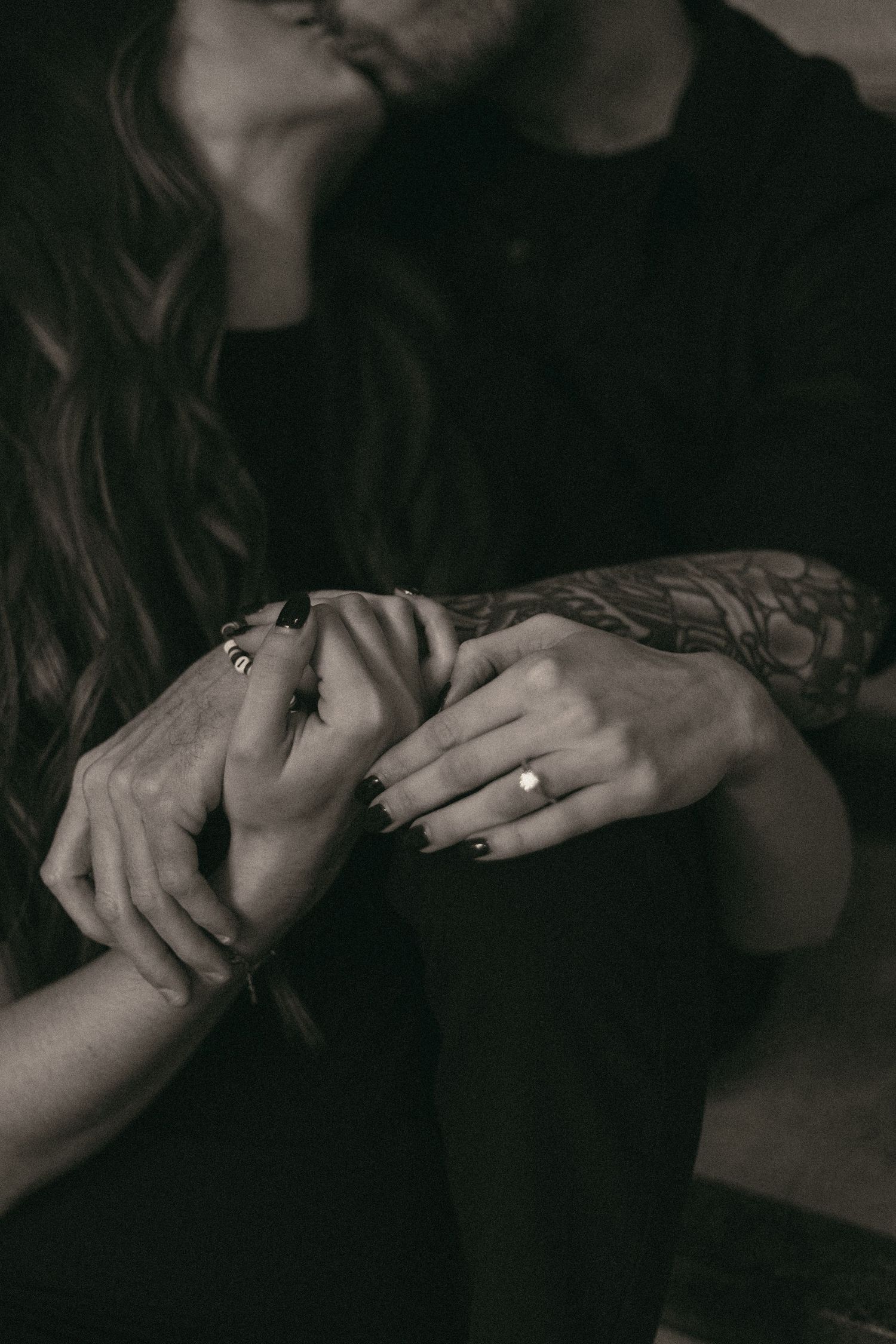 Engaged couple kissing in Cleveland Ohio by Gypsy Lens Photography. Moody, filmy, vintage, documentary wedding photography