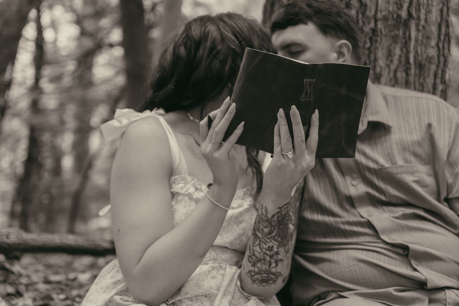 Romantic forest scene couple kissing in Lake County Ohio by Gypsy Lens Photography. Moody, filmy, vintage, documentary wedding photography