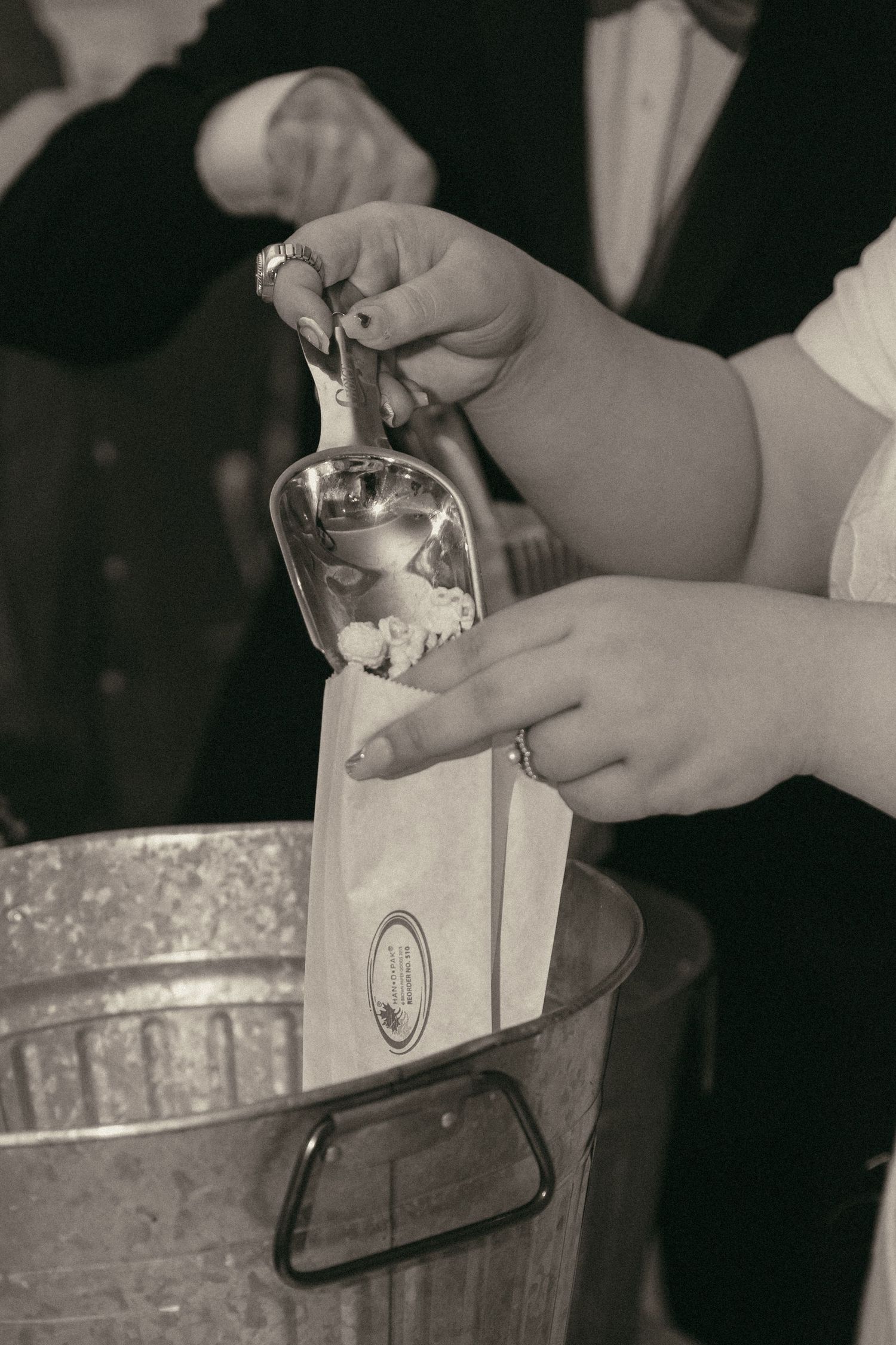 Black and white detail of popcorn bar in Cleveland Ohio by Gypsy Lens Photography. Moody, filmy, vintage, documentary wedding photography.