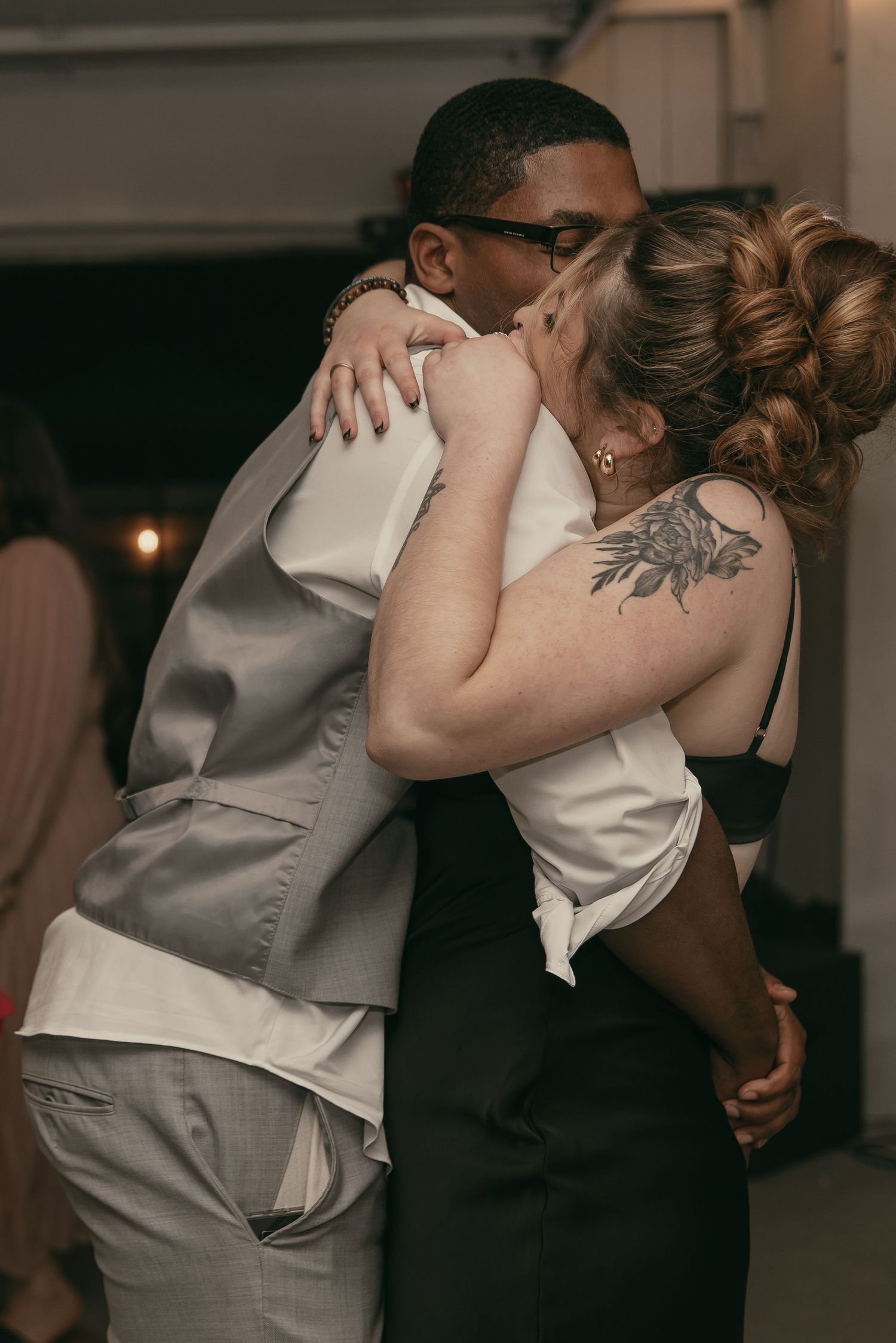 Couple sharing romantic dance at reception in Cleveland Ohio by Gypsy Lens Photography. Moody, vintage, documentary wedding photography.