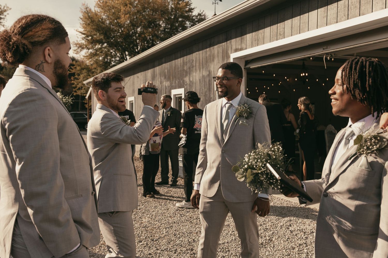 Groomsmen having fun on wedding day in Cleveland Ohio by Gypsy Lens Photography. Moody, vintage, documentary wedding photography.