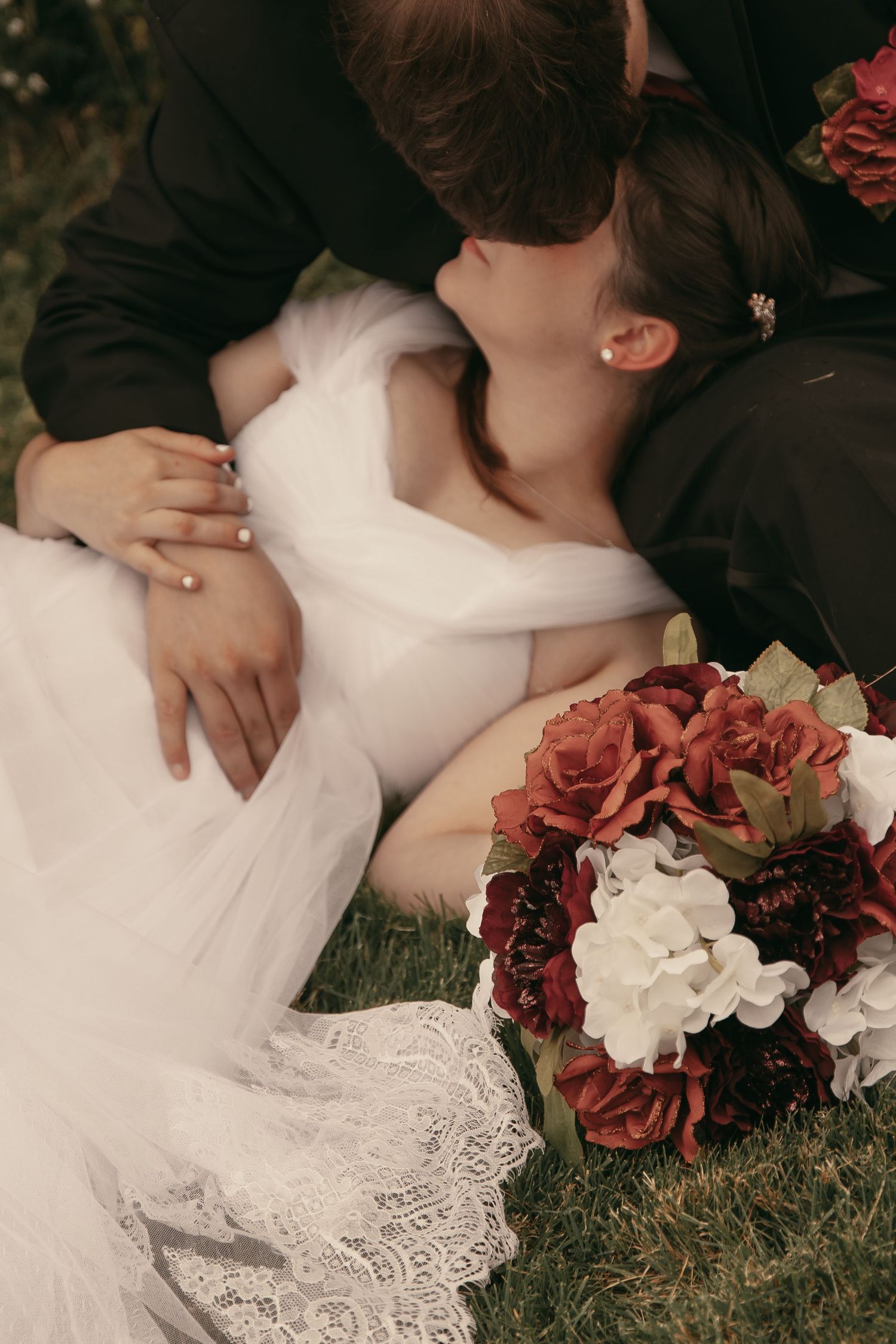 Intimate moment with newlyweds in Ashtabula Ohio by Gypsy Lens Photography. Moody, vintage, documentary wedding photography.